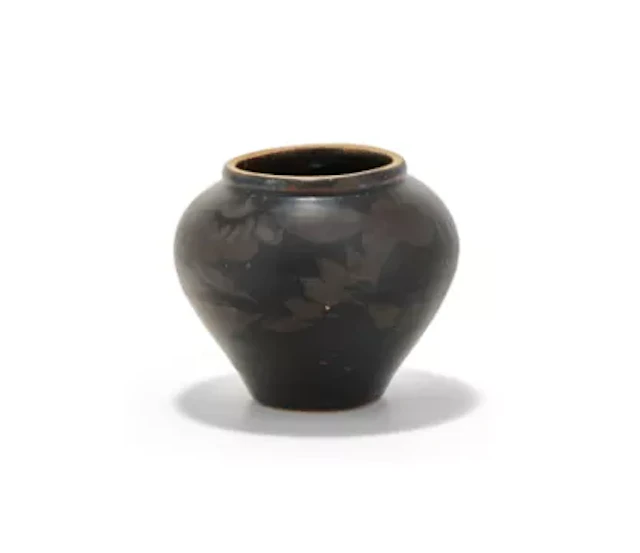 A small Chinese russet splashed black glazed jar, Jin or Yuan Dynasty