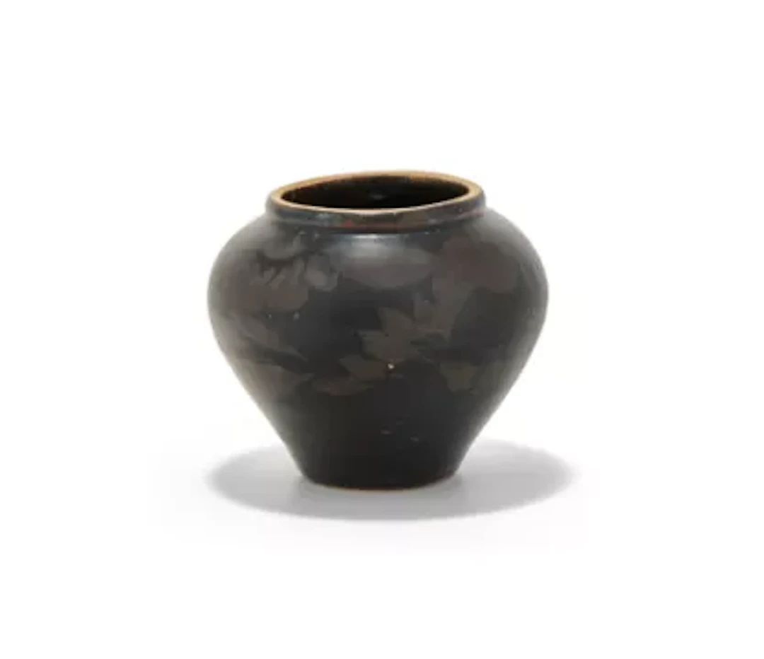 A small Chinese russet splashed black glazed jar, Jin or Yuan Dynasty