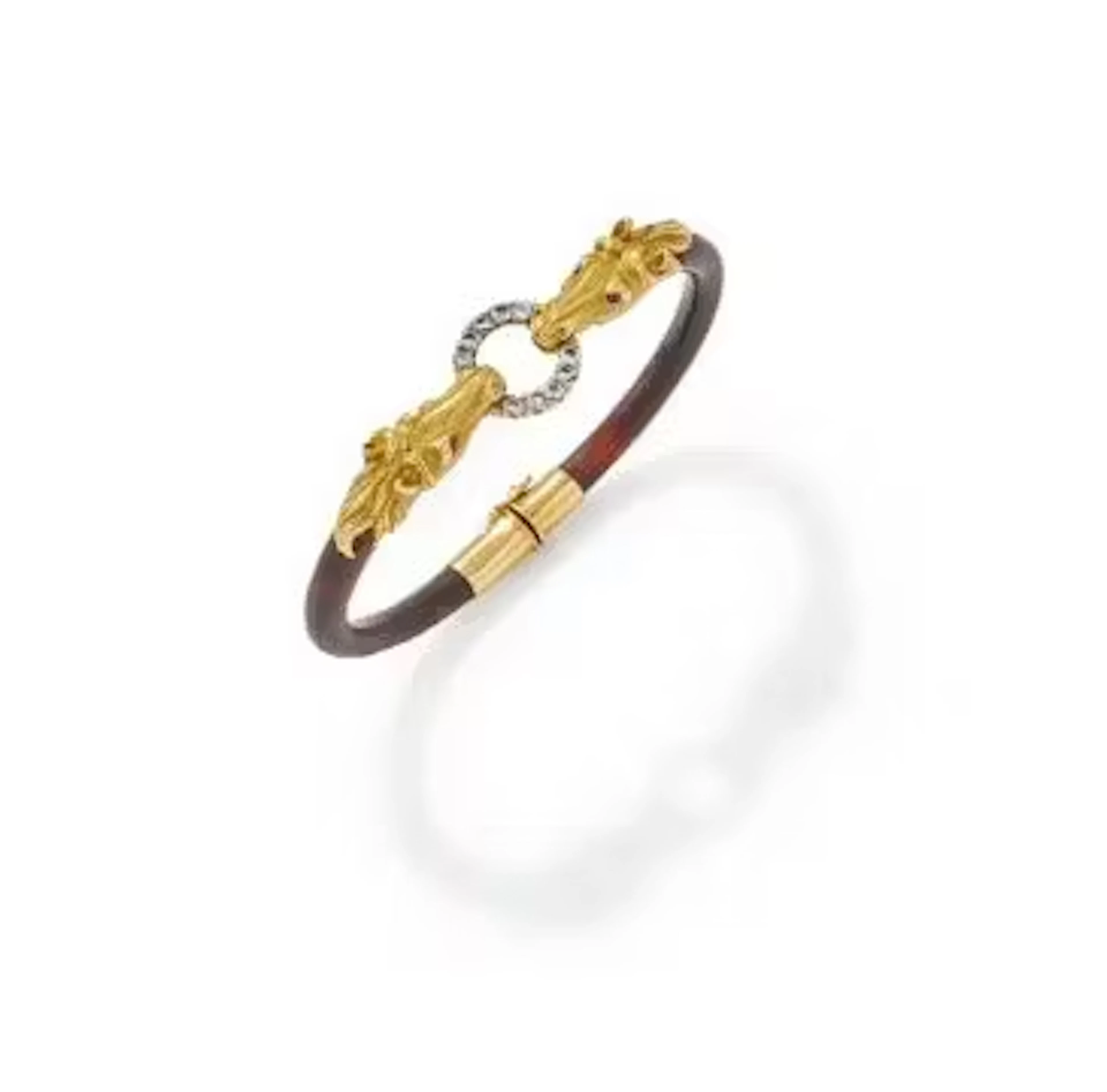 Y GAY FRERES, A TORTOISESHELL AND GEM SET BANGLE