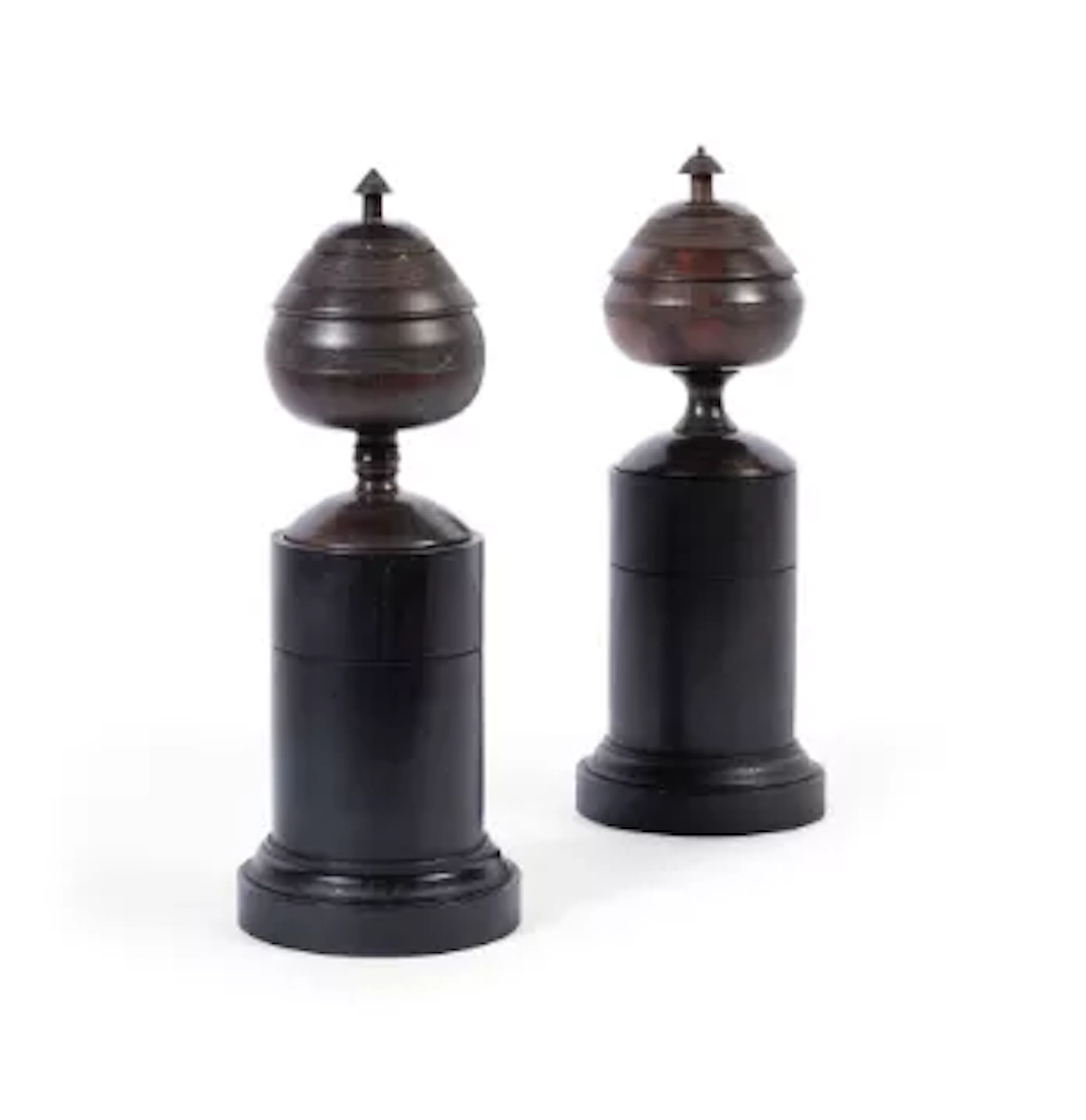 A PAIR OF AFRICAN BLACK WOOD URNS ON PAINTED PEDESTALS BY GEORGE OAKES