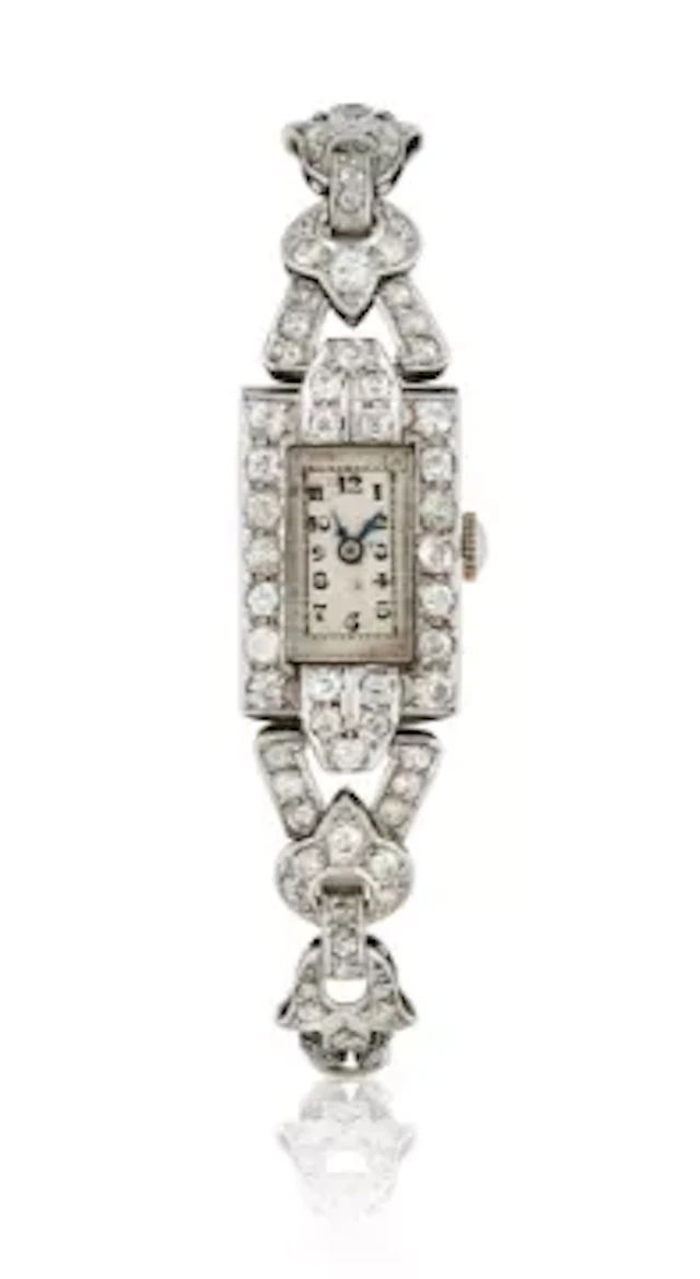 A LADY'S PLATINUM, WHITE GOLD AND DIAMOND COCKTAIL WATCH
