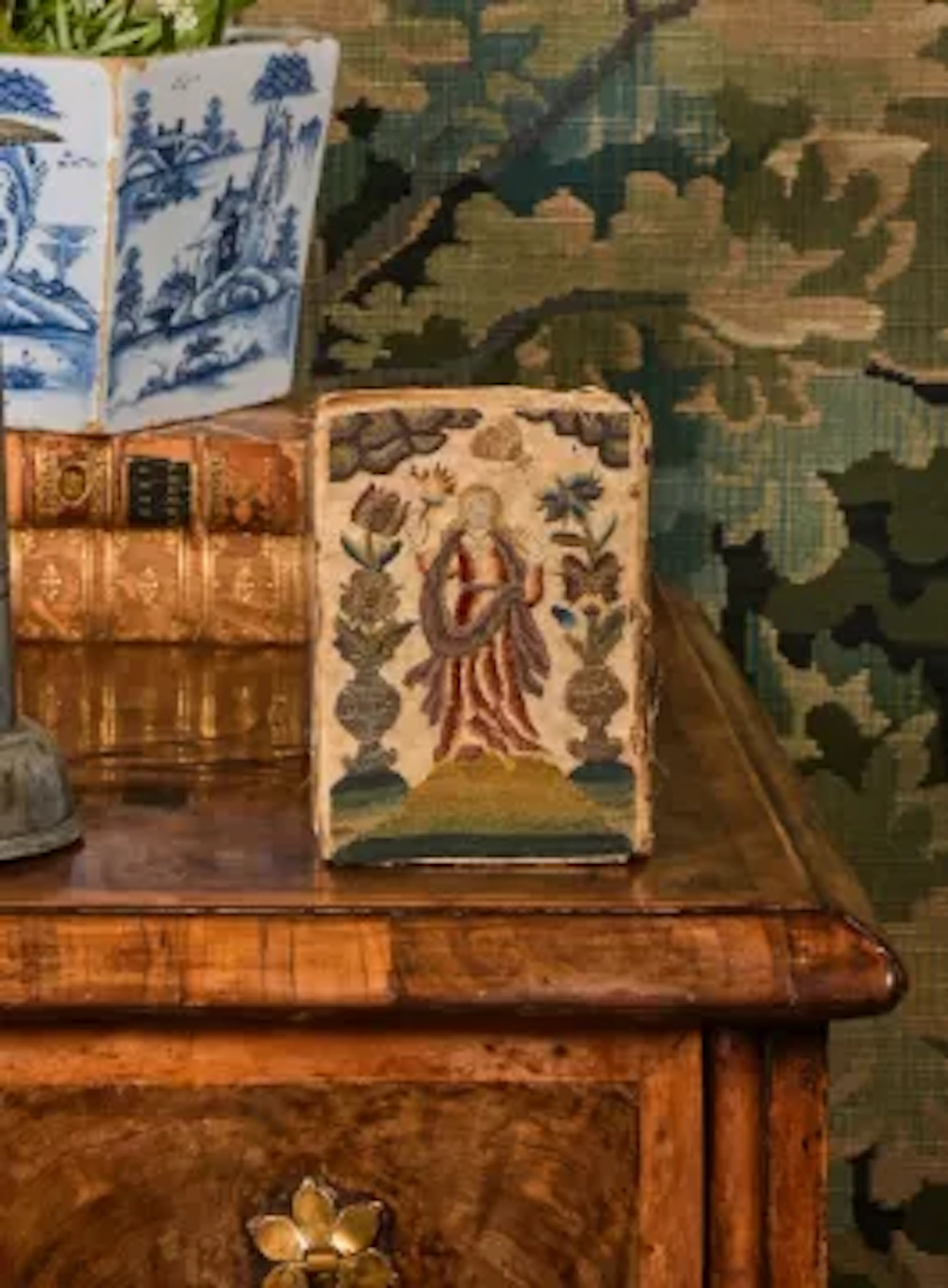 A LATE CHARLES I OR EARLY CHARLES II RAISED WORK OR STUMP WORK BOUND