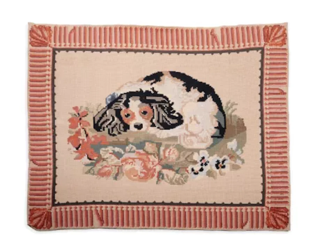 A CROSS-STITCH, NEEDLEWORK RUG DEPICTING A SPANIEL, FOR SIBYL COLEFAX