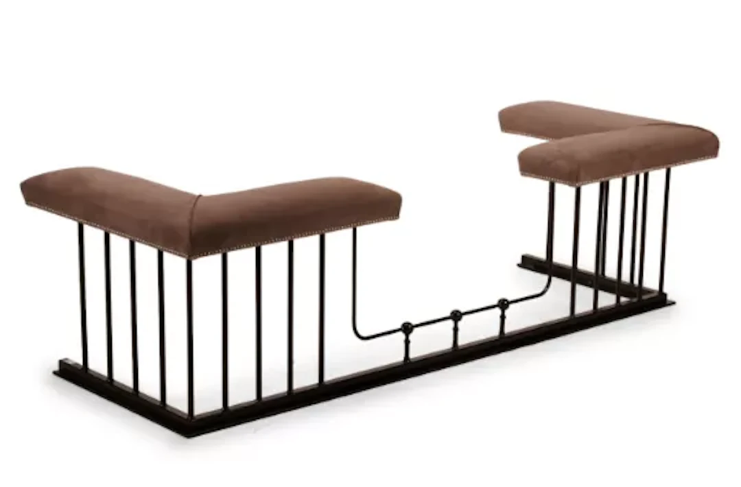 A WROUGHT IRON AND SUEDE UPHOLSTERED CLUB FENDER, CONTEMPORARY