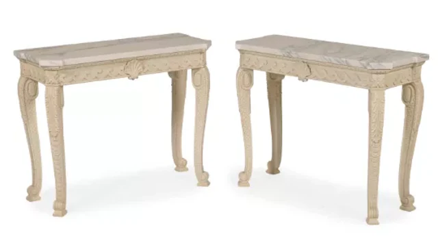 A PAIR OF CARVED WOOD AND GESSO PAINTED CONSOLE TABLES, IN THE MANNER