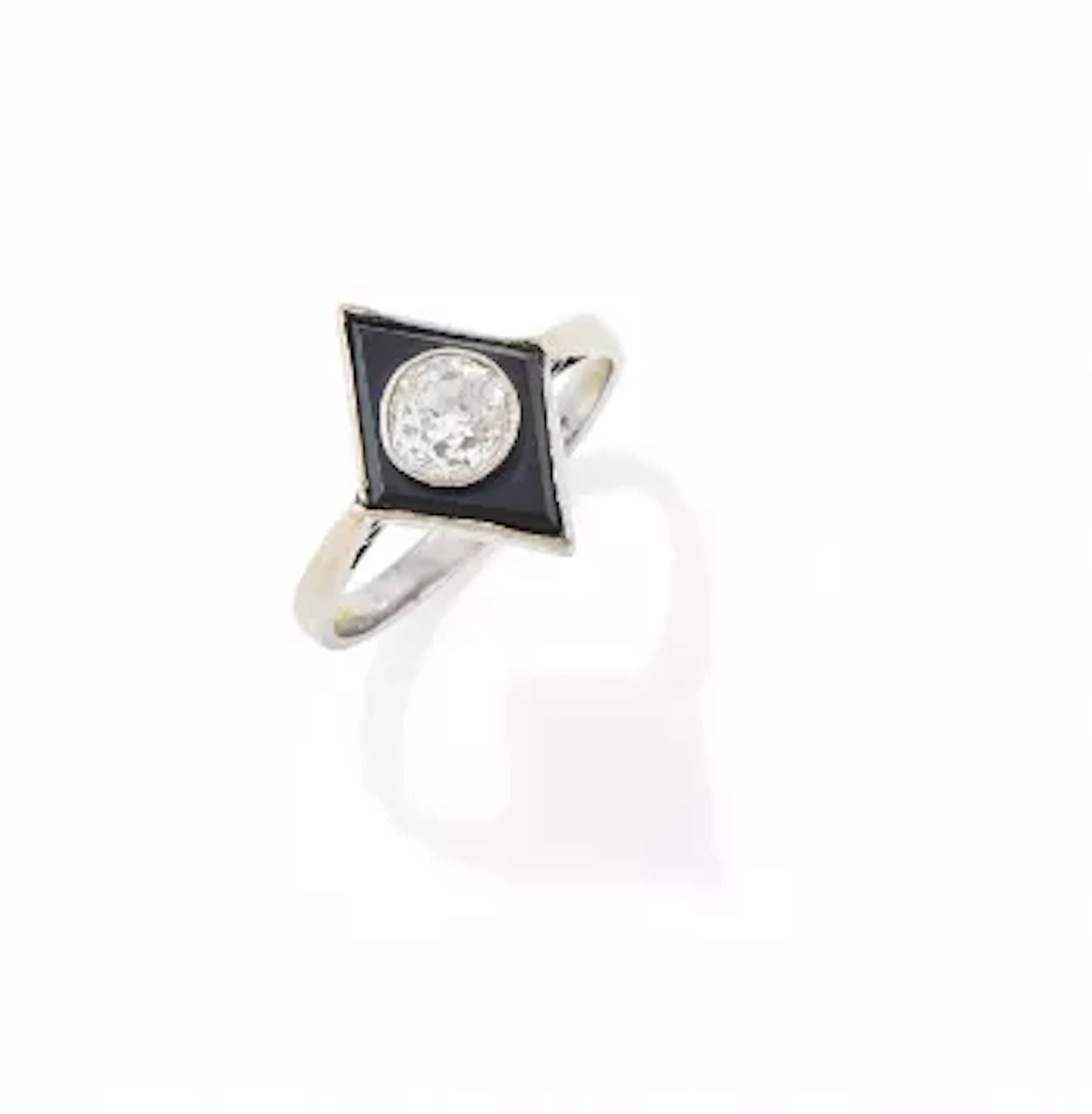 AN EARLY 20TH CENTURY ONYX AND DIAMOND RING