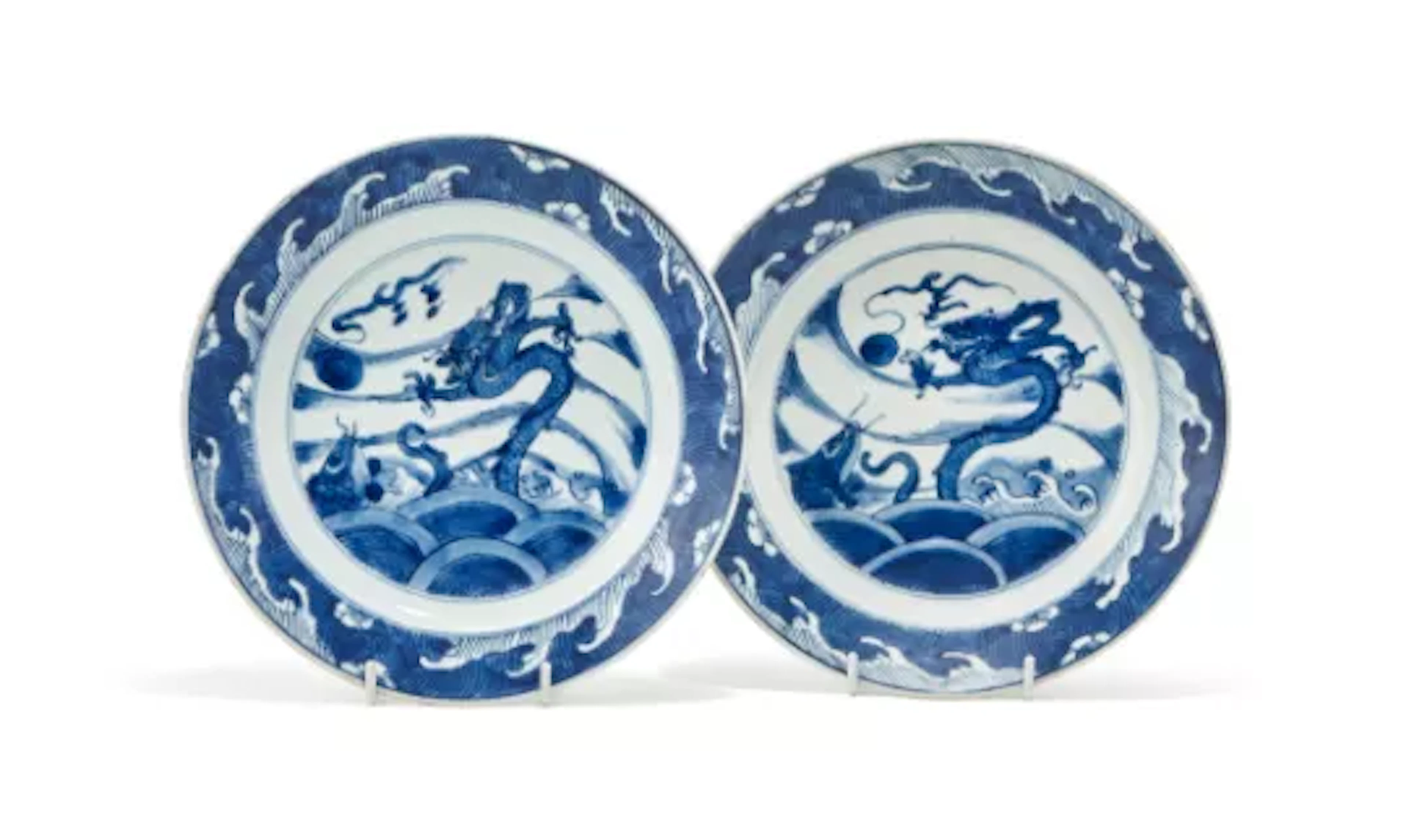 A pair of Chinese blue and, white ‘dragon and carp’ dishes