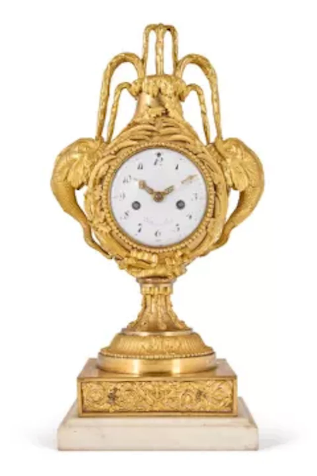 A LOUIS XVI STYLE ORMOLU MOUNTED WHITE MARBLE MANTEL CLOCK 'VASE PENDULE