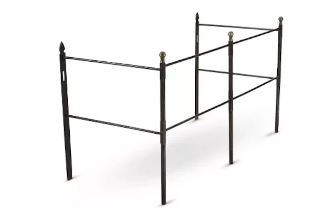 A STEEL AND BRASS FIRE RAIL, 19TH CENTURY