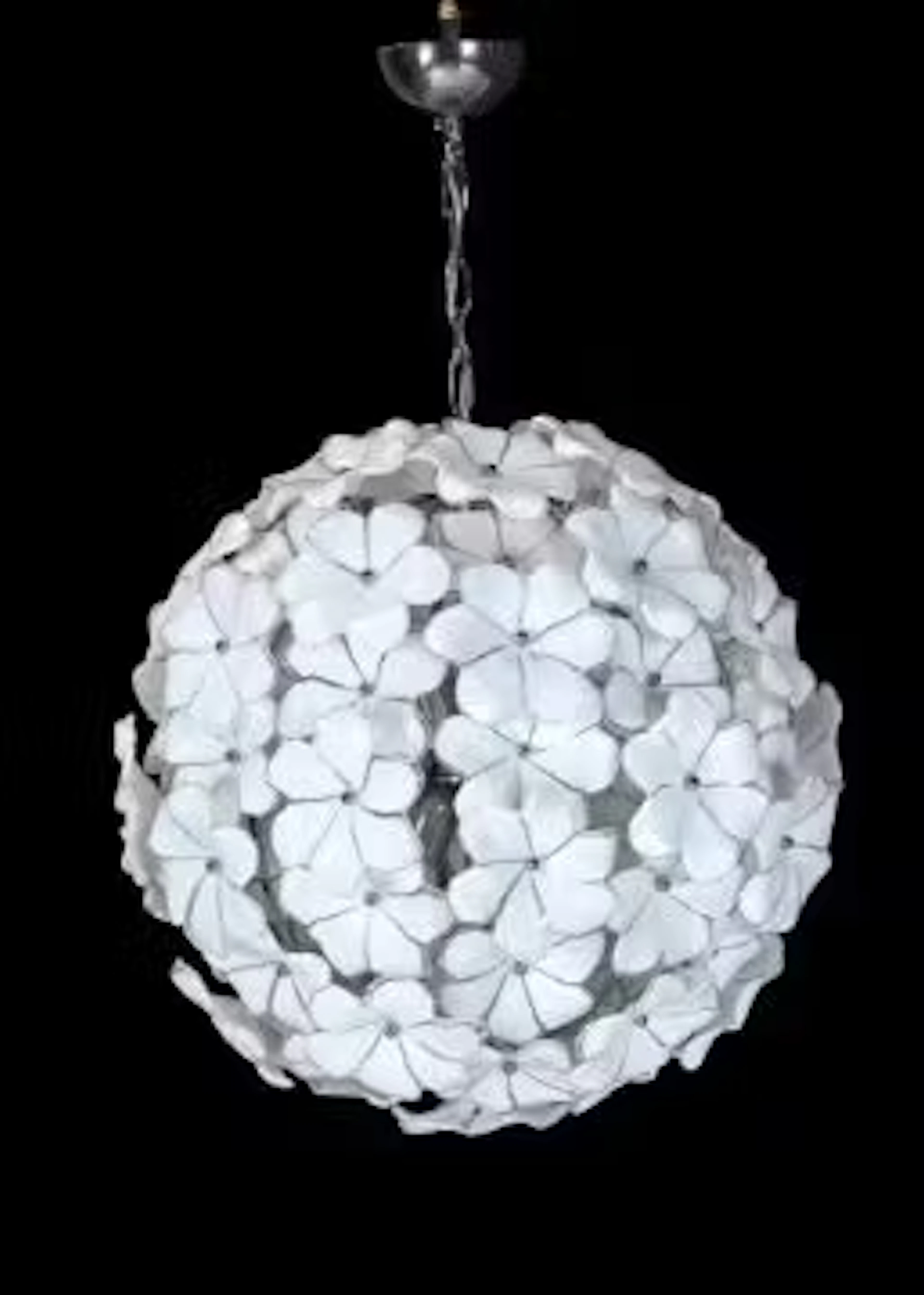 A CLEAR AND WHITE GLASS CHANDELIER, MODERN