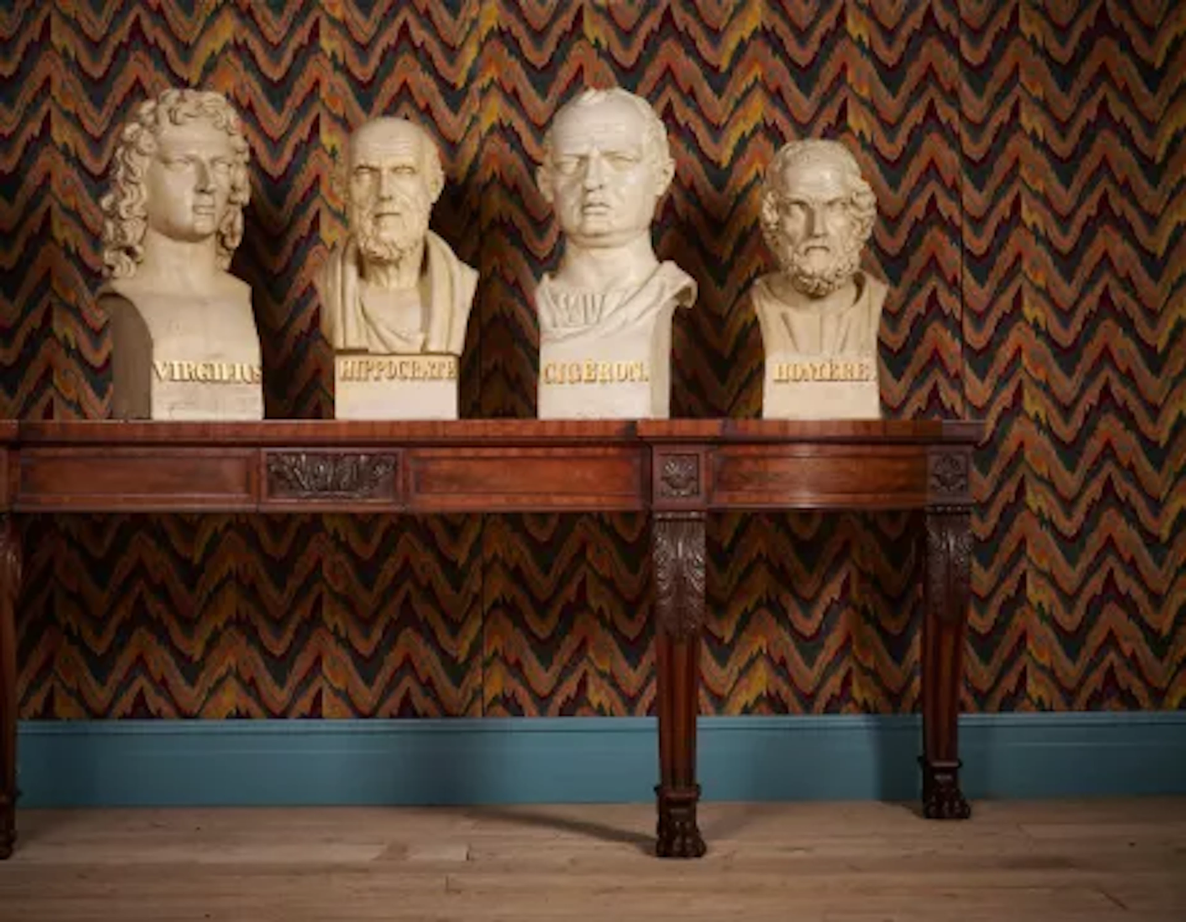A SET OF FOUR LARGE TERRACOTTA LIBRARY BUSTS OF HIPPOCRATES, HOMER
