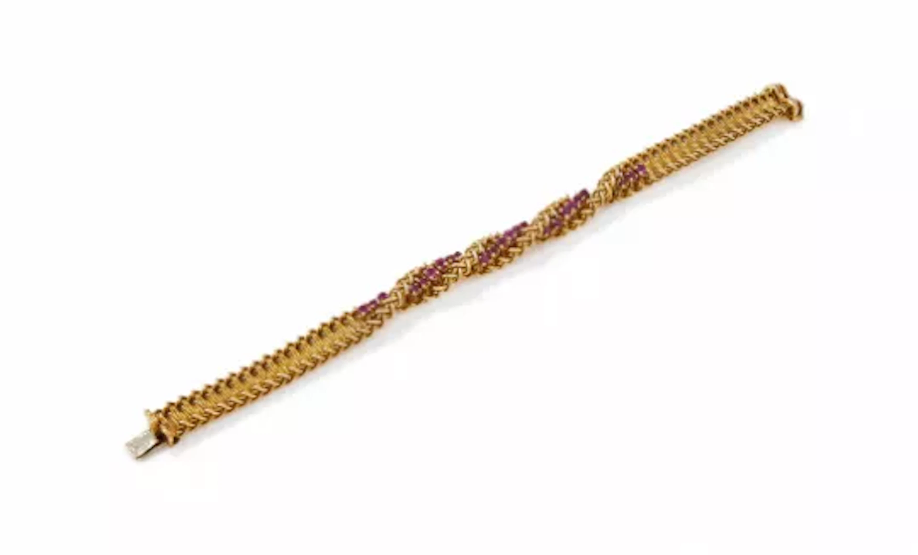 CARTIER, AN 18 CARAT GOLD AND RUBY BRACELET, CIRCA 1964