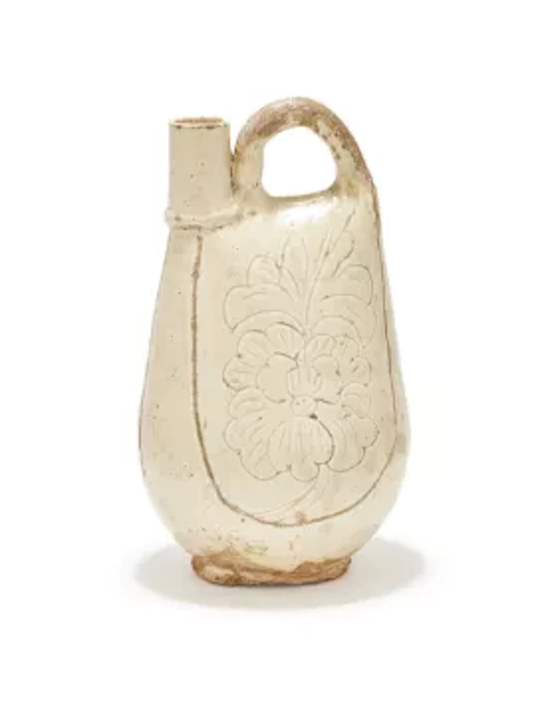 A Chinese white-glazed carved 'Peony' flask, Liao Dynasty (960-1125)
