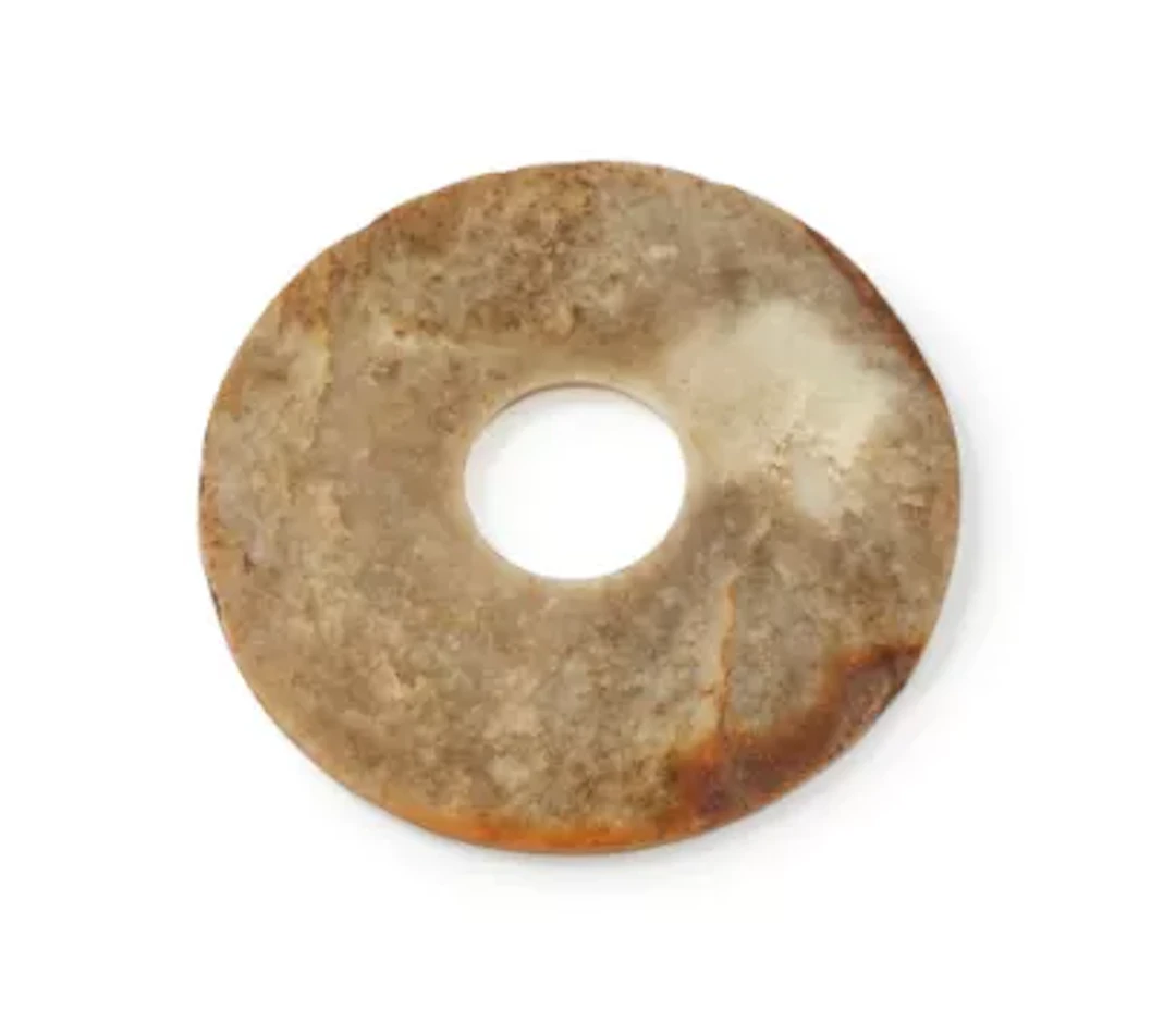 A large Chinese jade disc, bi, Neolithic period, circa 3000 BC- 2000 BC
