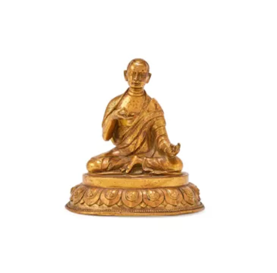 A Sino-Tibetan gilt bronze figure of seated Arahat, 19th century