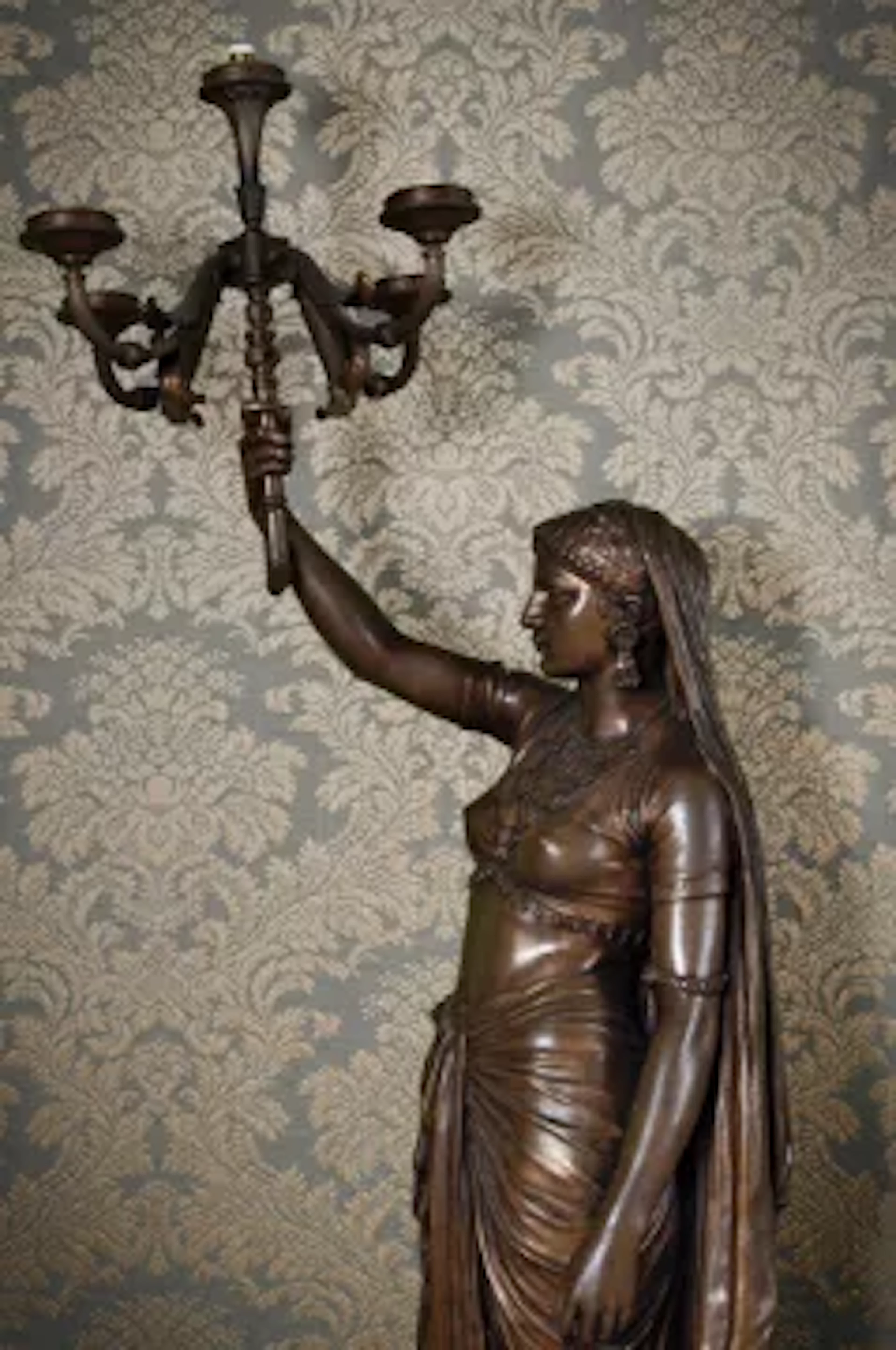 AFTER ÉMILE-CORIOLAN-HIPPOLYTE GUILLEMIN, A BRONZE FIGURAL LIGHT OR