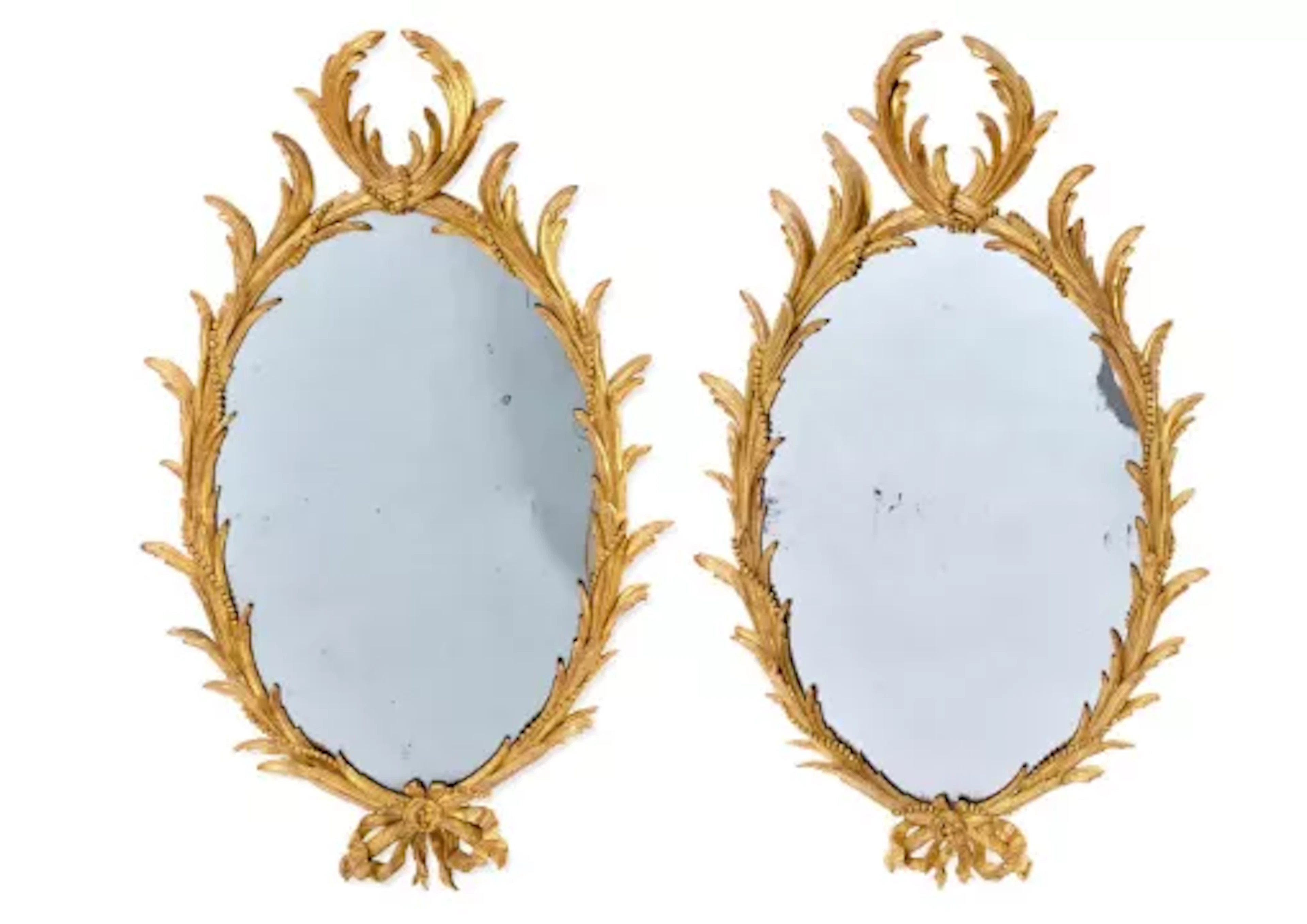 A PAIR OF CARVED GILTWOOD MIRRORS, ONE CIRCA 1760, THE OTHER PROBABLY