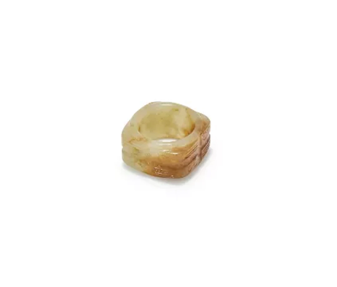 A small Chinese celadon and russet jade cong, Ming Dynasty or earlier