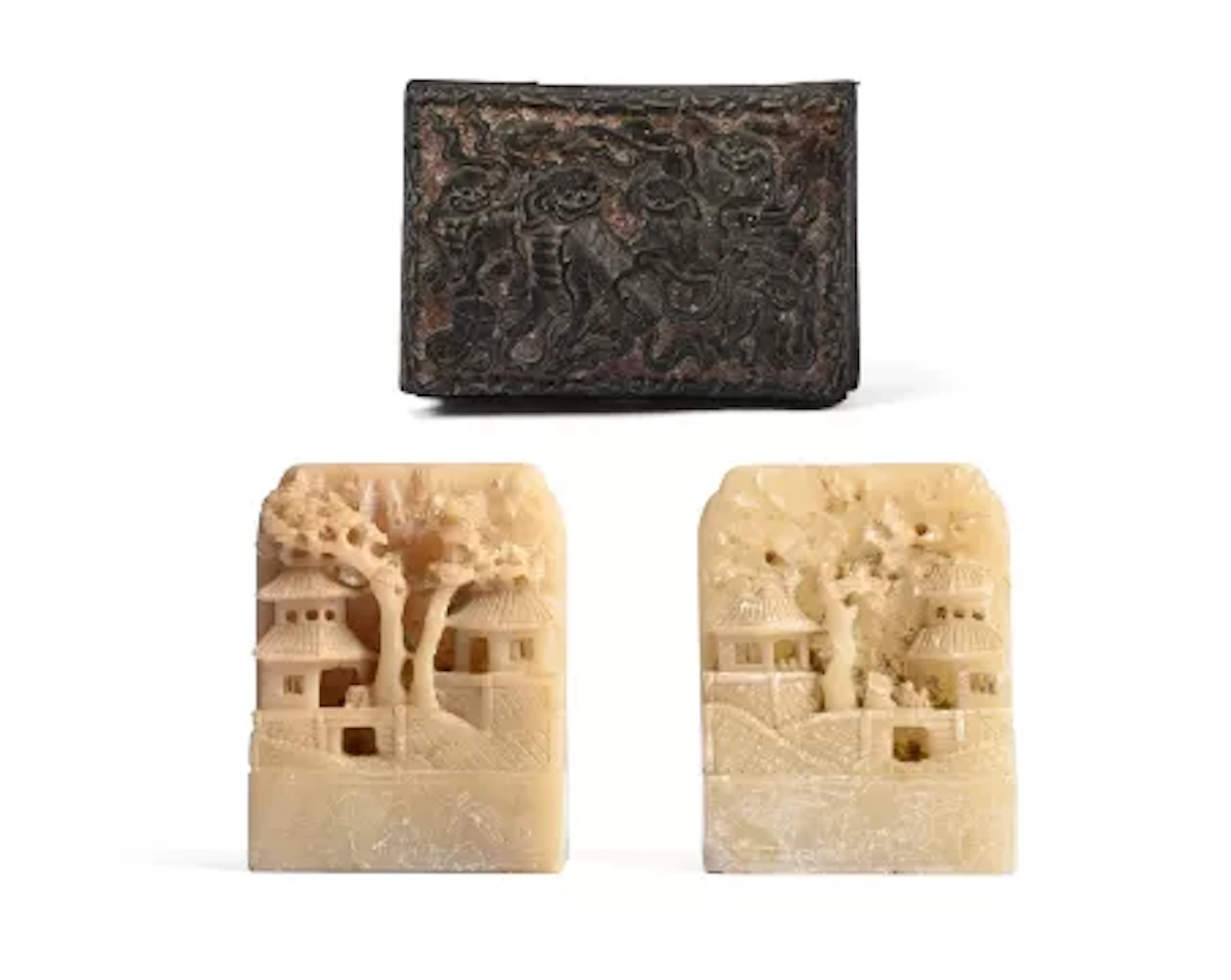 A PAIR OF CHINESE SOAPSTONE BOOKENDS, 20TH CENTURY, ALONG WITH A BLACK