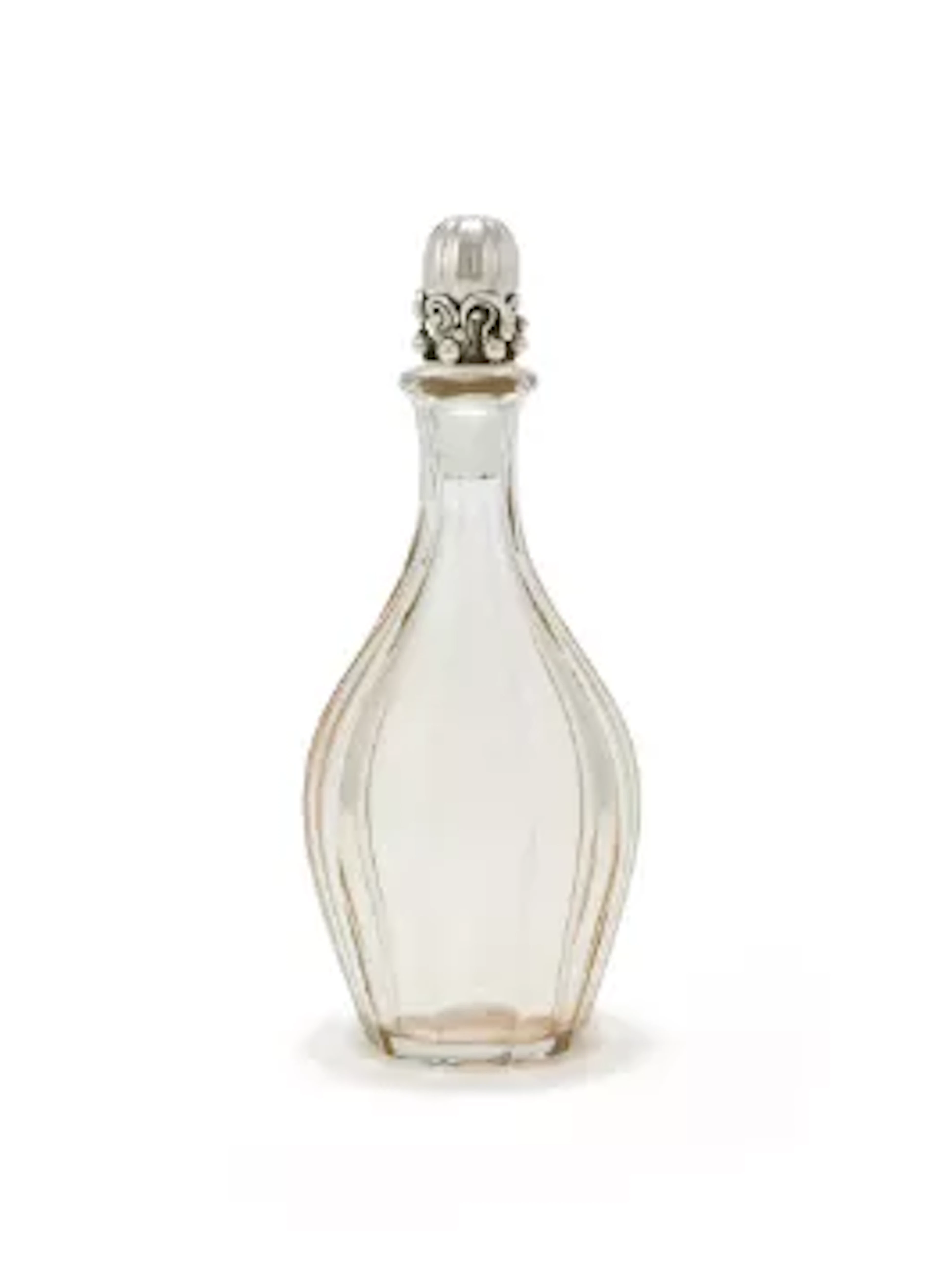 BACCARAT, A GLASS DECANTER WITH A SILVER STOPPER BY GEORG JENSEN LTD.
