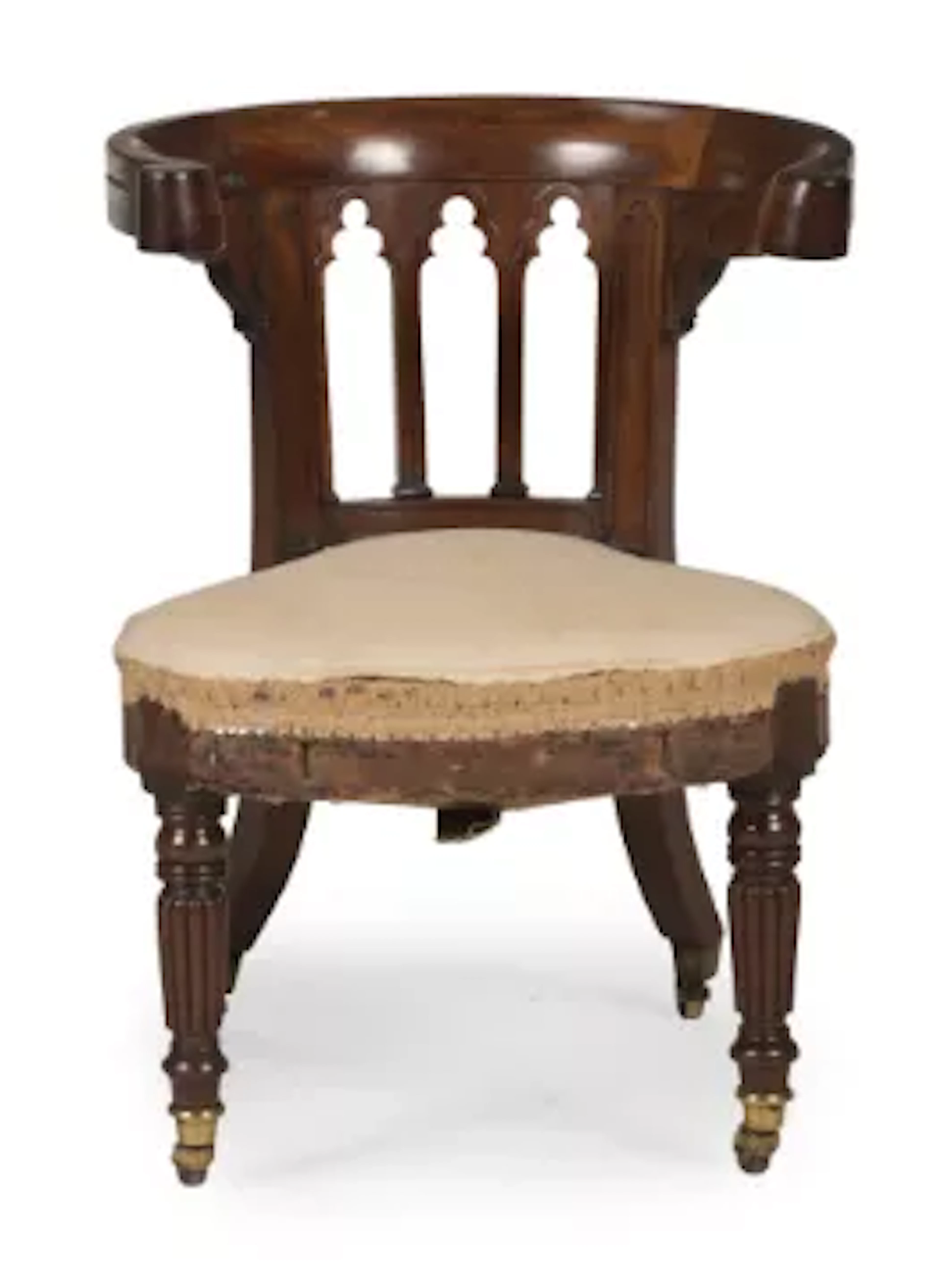 A GEORGE IV MAHOGANY GOTHIC LIBRARY READING CHAIR, IN THE MANNER OF