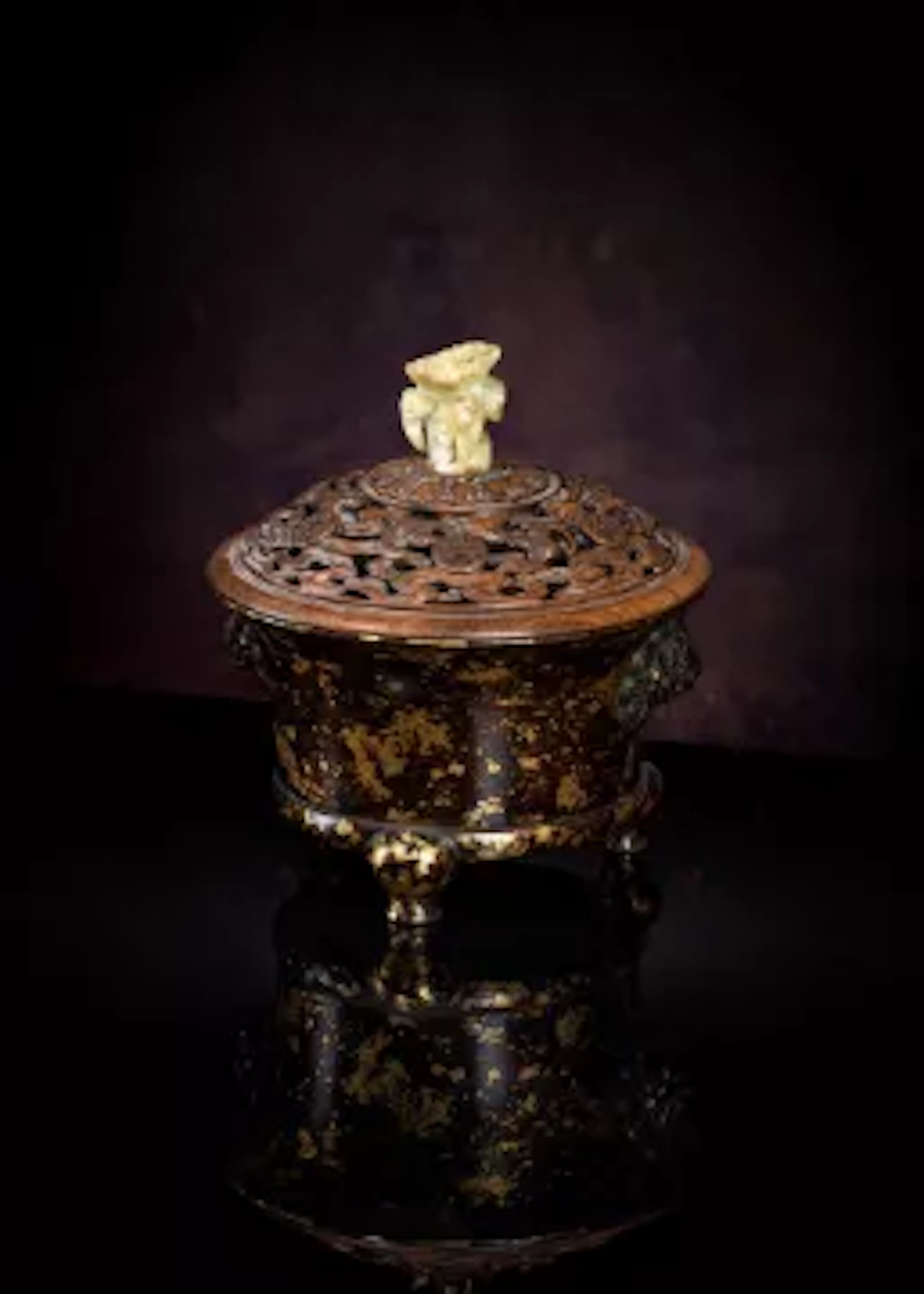 A rare Chinese gilt-splashed bronze tripod censer
