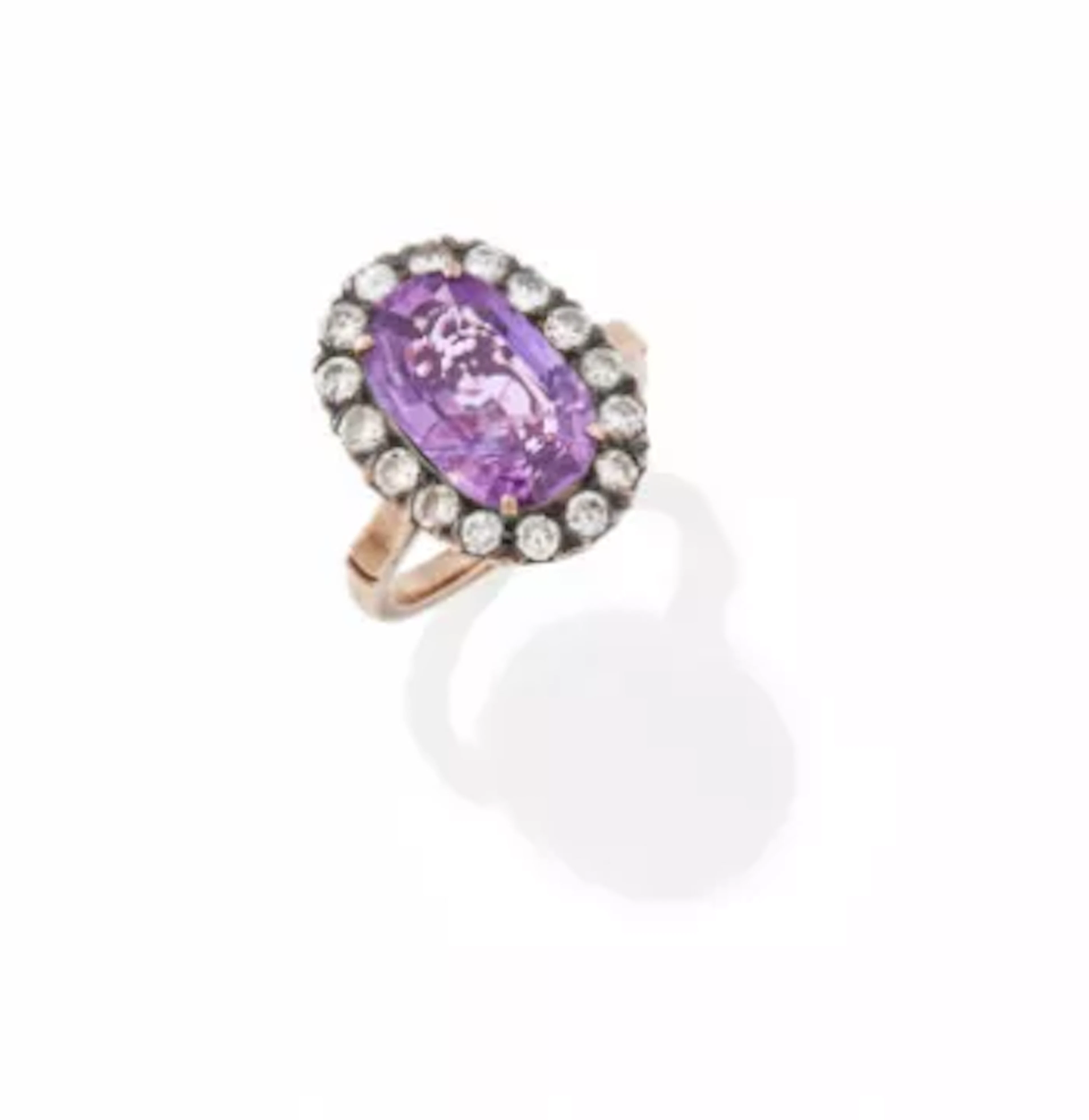 A PINK SAPPHIRE AND DIAMOND CLUSTER RING