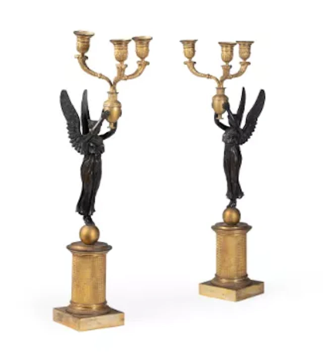 A PAIR OF FRENCH BRONZE AND GILT METAL THREE-LIGHT CANDELABRA, IN