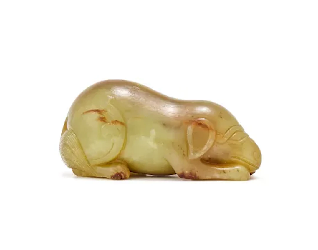 A Chinese mottled yellow jade ram, Qing Dynasty