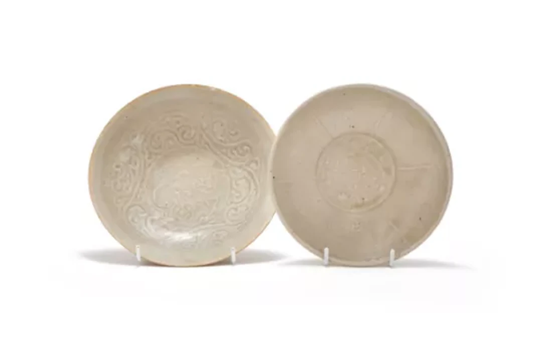 A Chinese qingbai pale celadon moulded 'lion' bowl, Southern Song