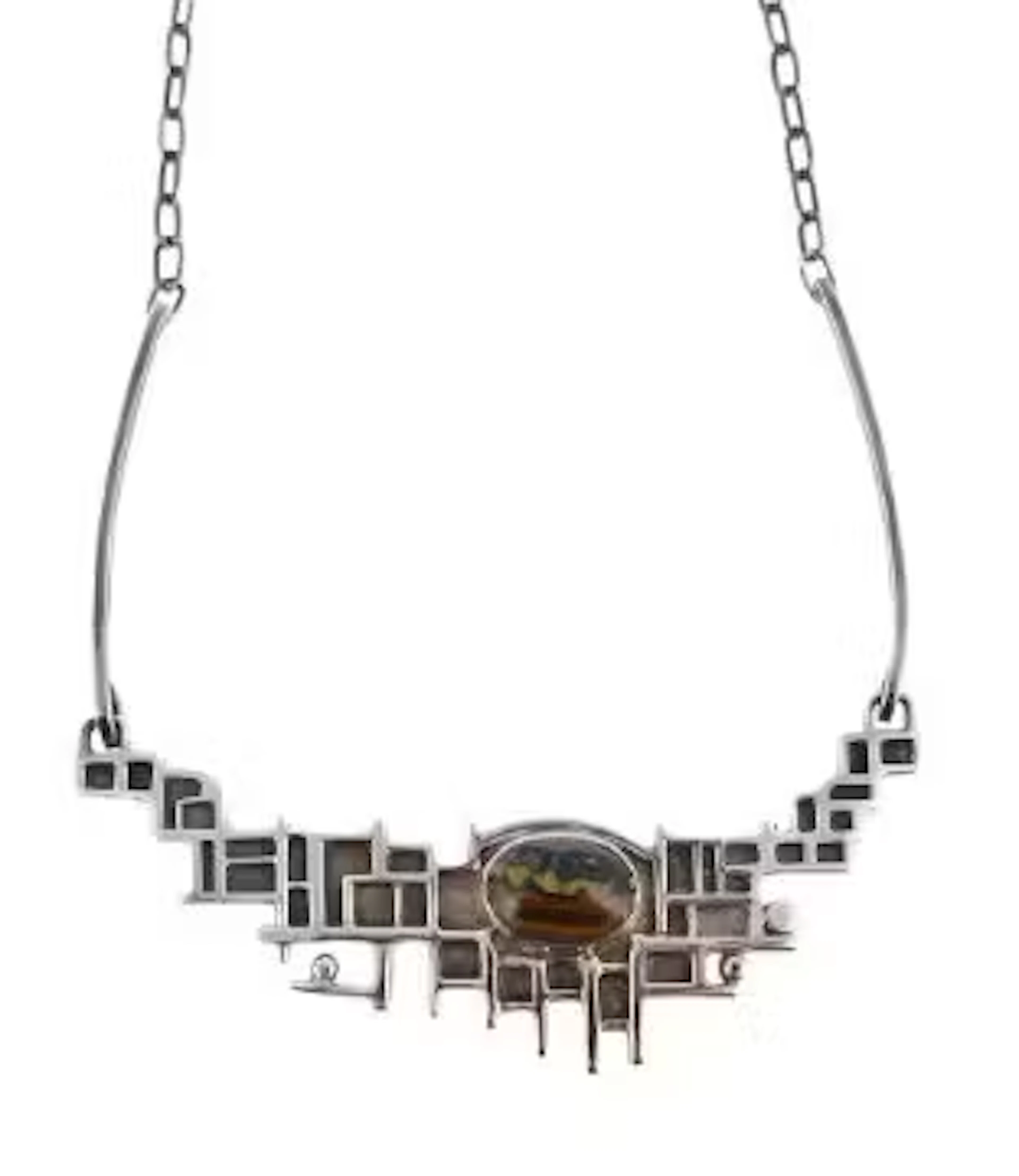 OLA M. GORIE, A SILVER AND HAWKS EYE NECKLACE