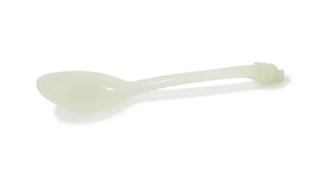 A Chinese carved white jade 'dragon' spoon