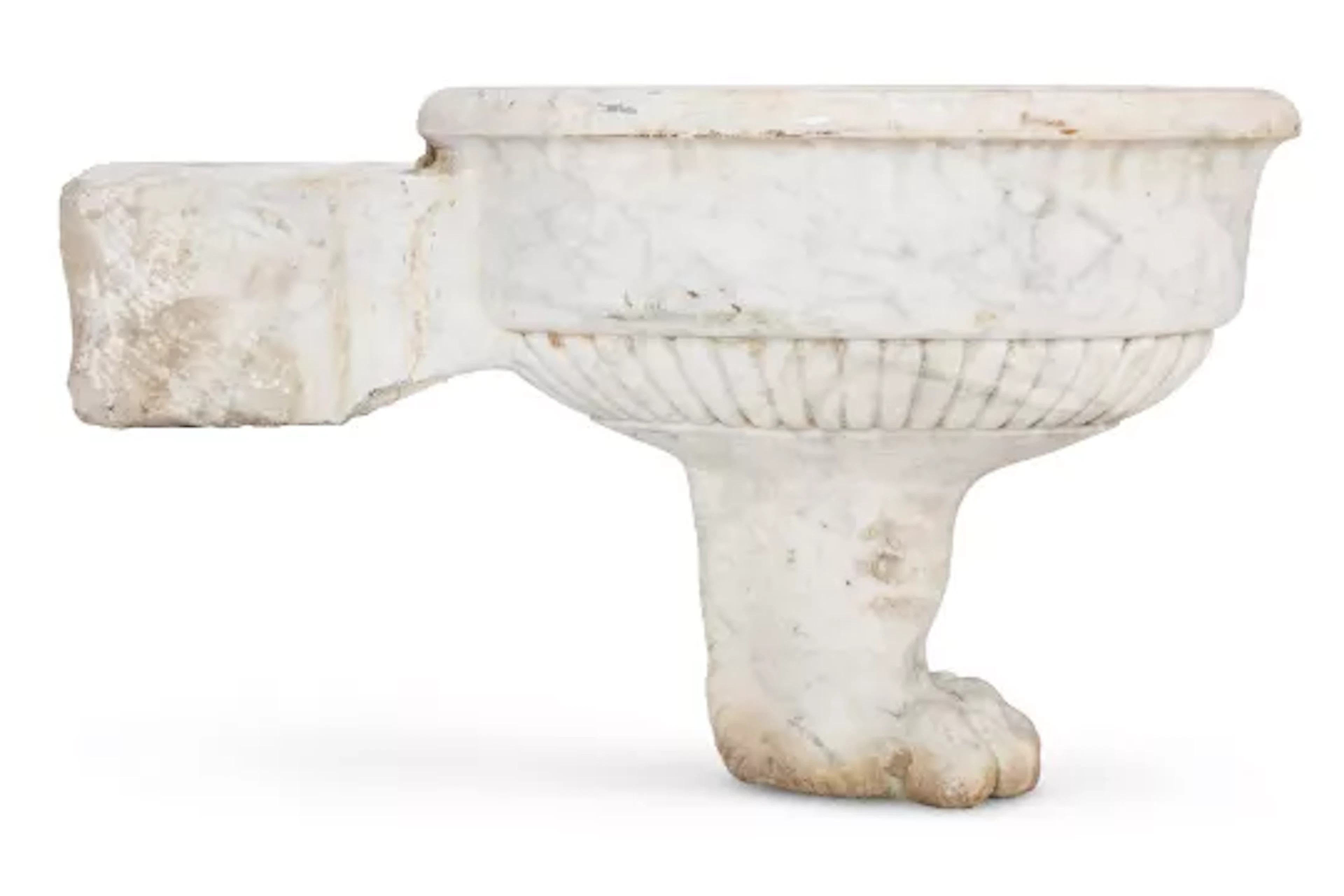 A CARVED WHITE MARBLE LION FOOT OVAL BASIN , 19TH CENTURY
