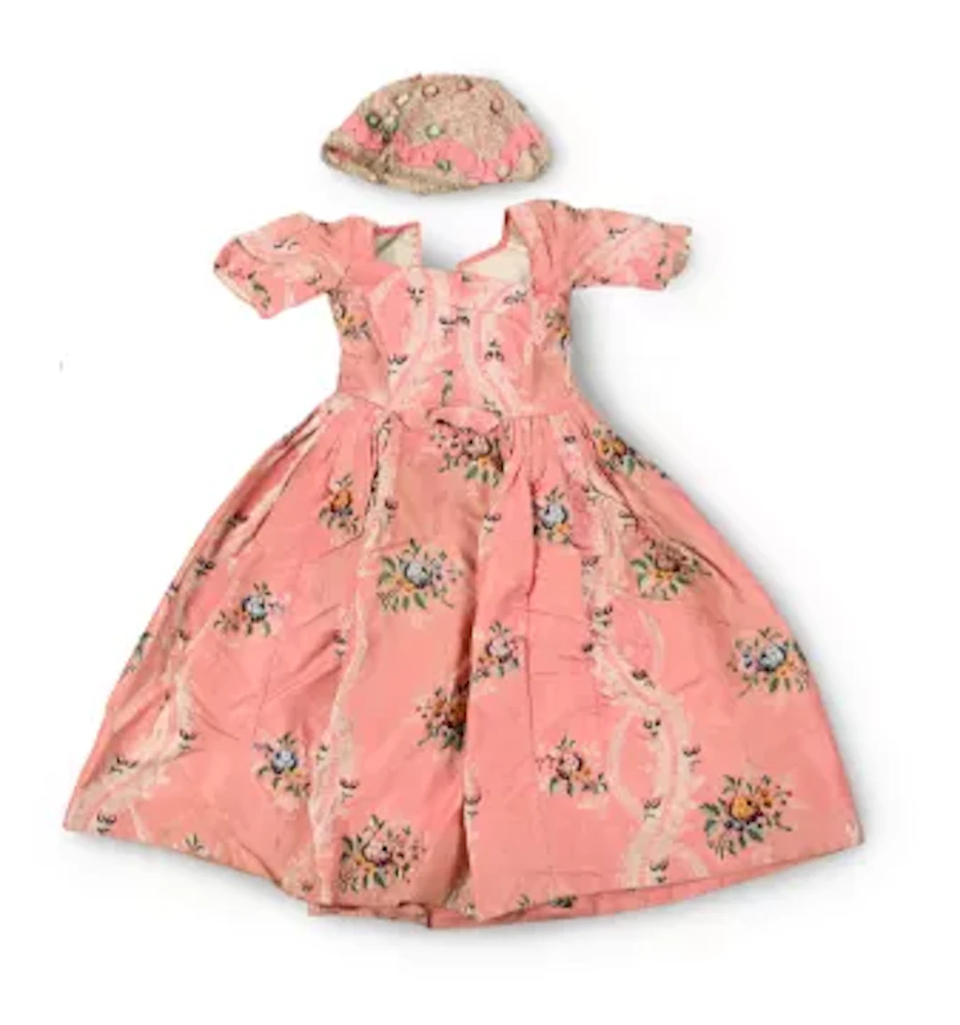 A GEORGE III PINK SILK BROCADE DRESS AND SIMILAR CAP, THIRD QUARTER