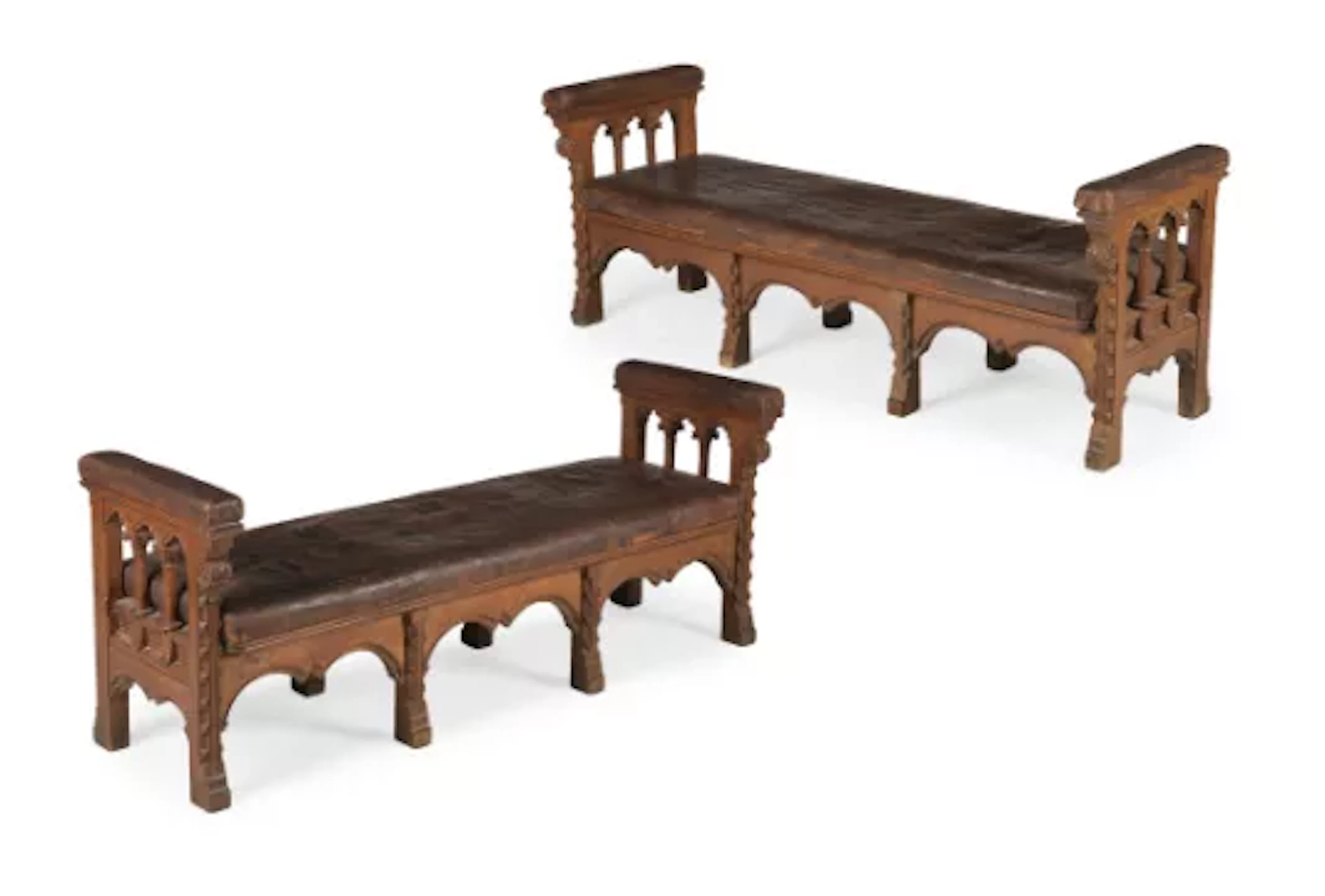 A PAIR OF CARVED OAK GOTHIC REVIVAL HALL BENCHES, IN THE MANNER OF