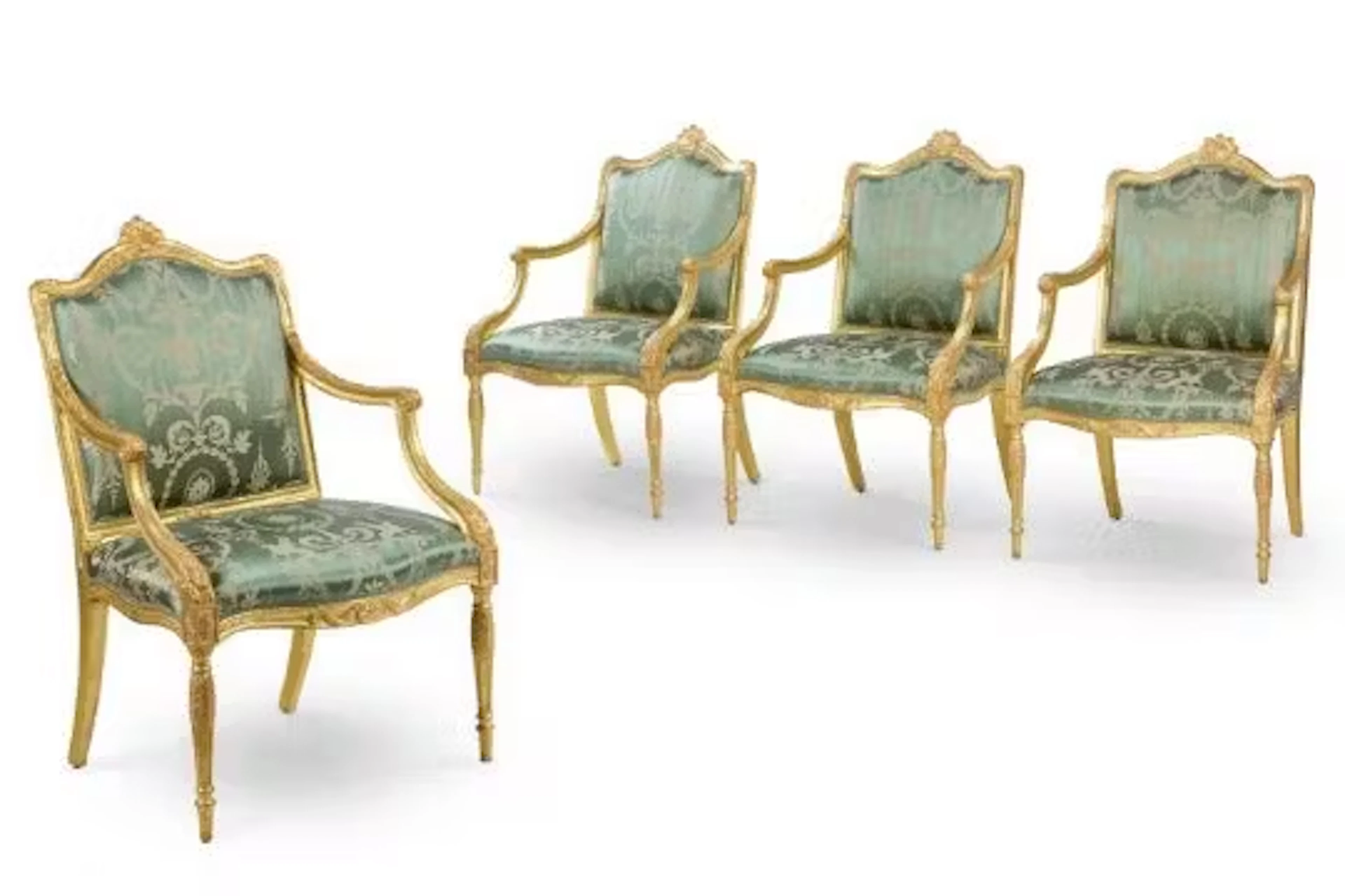 ‡ A SET OF FOUR GEORGE III GILTWOOD ARMCHAIRS, ATTRIBUTED TO INCE & MAYHEW