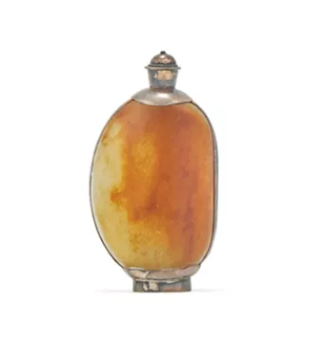 A Chinese jade pebble and silver coated snuff bottle, Qing Dynasty