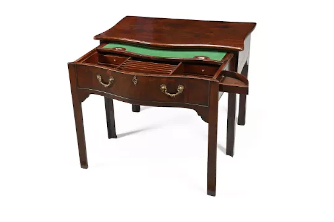 A GEORGE III MAHOGANY SERPENTINE FRONTED WRITING OR SIDE TABLE, CIRCA 1760
