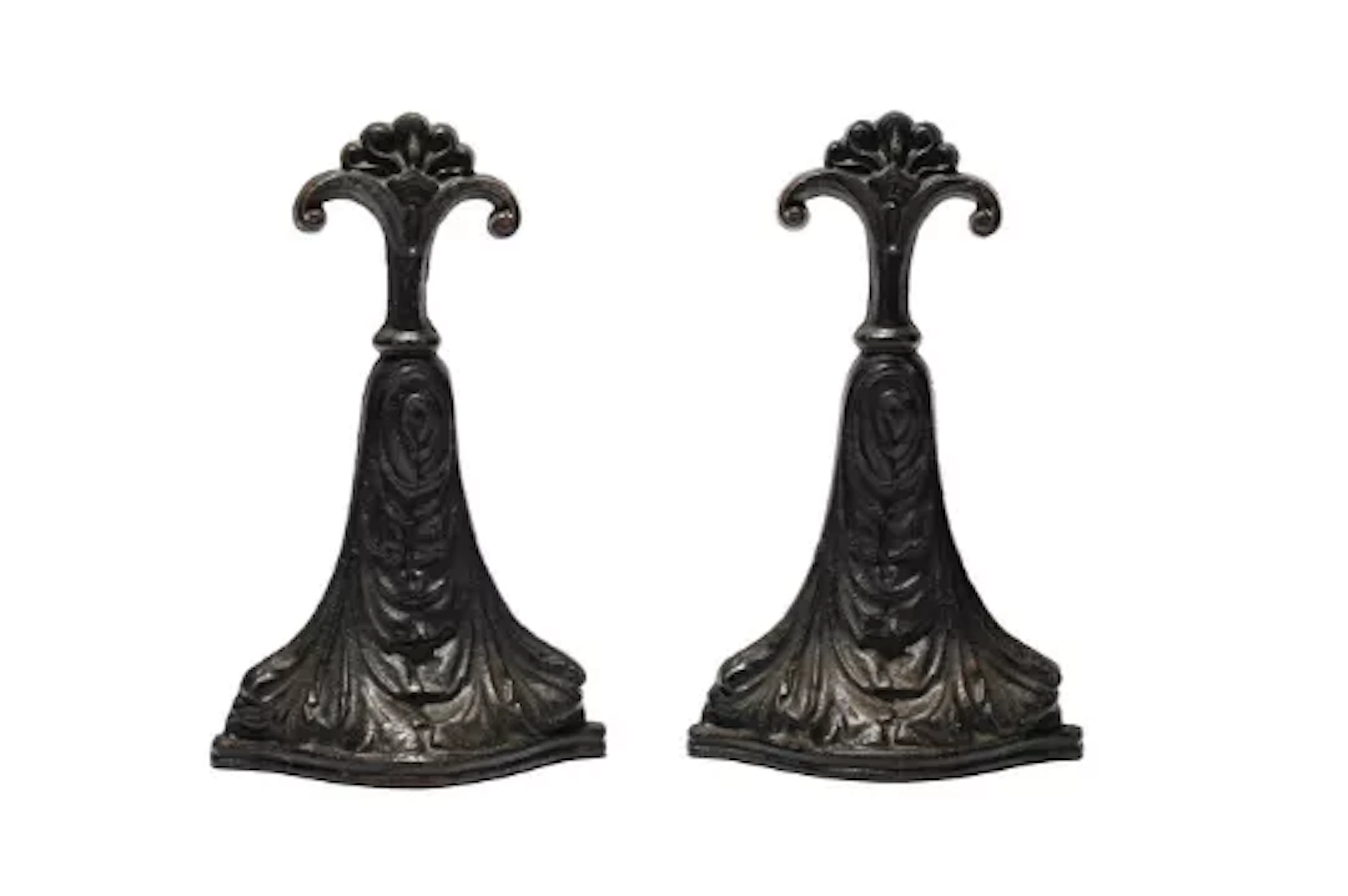 A PAIR OF VICTORIAN CAST IRON DOOR PORTERS, CIRCA 1880, BY CROSS LTD