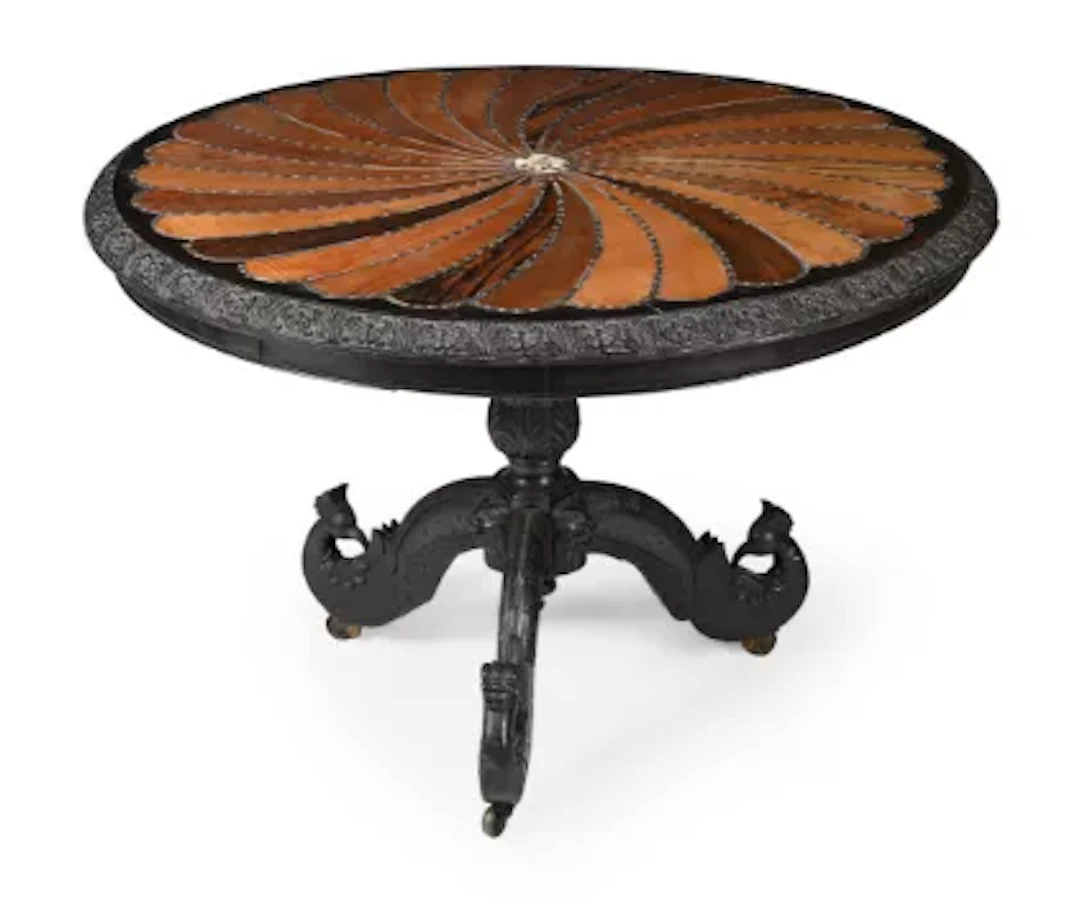 Y A CEYLONESE EBONY AND SPECIMEN TIMBER CENTRE TABLE, IN THE MANNER