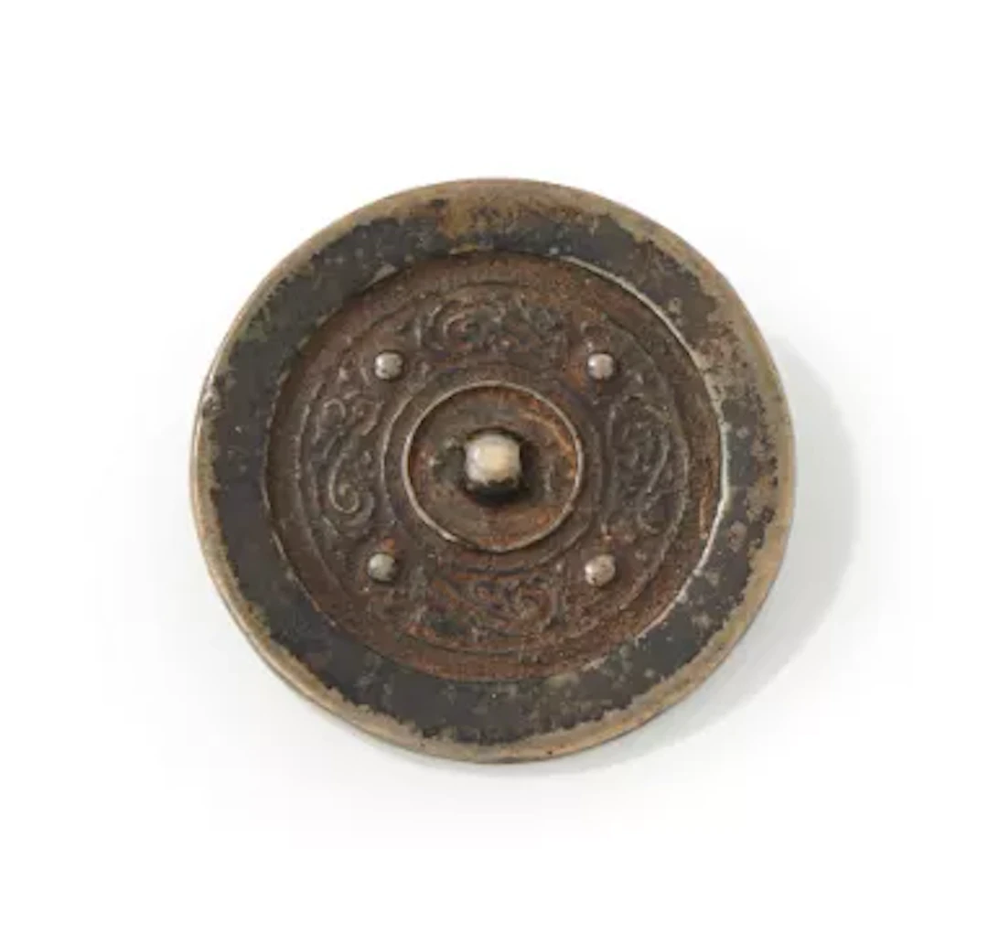 A Chinese bronze mirror, Han Dynasty (202 BC - 220 AD)