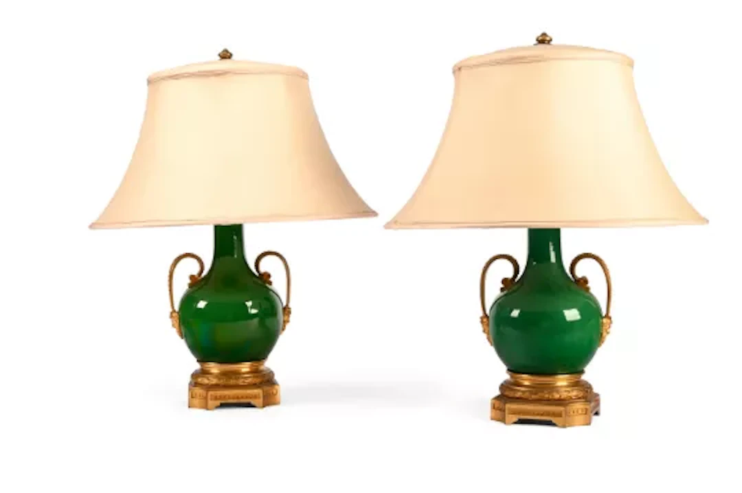 A PAIR OF FRENCH GILT BRONZE MOUNTED GREEN GLAZED BOTTLE VASE TABLE