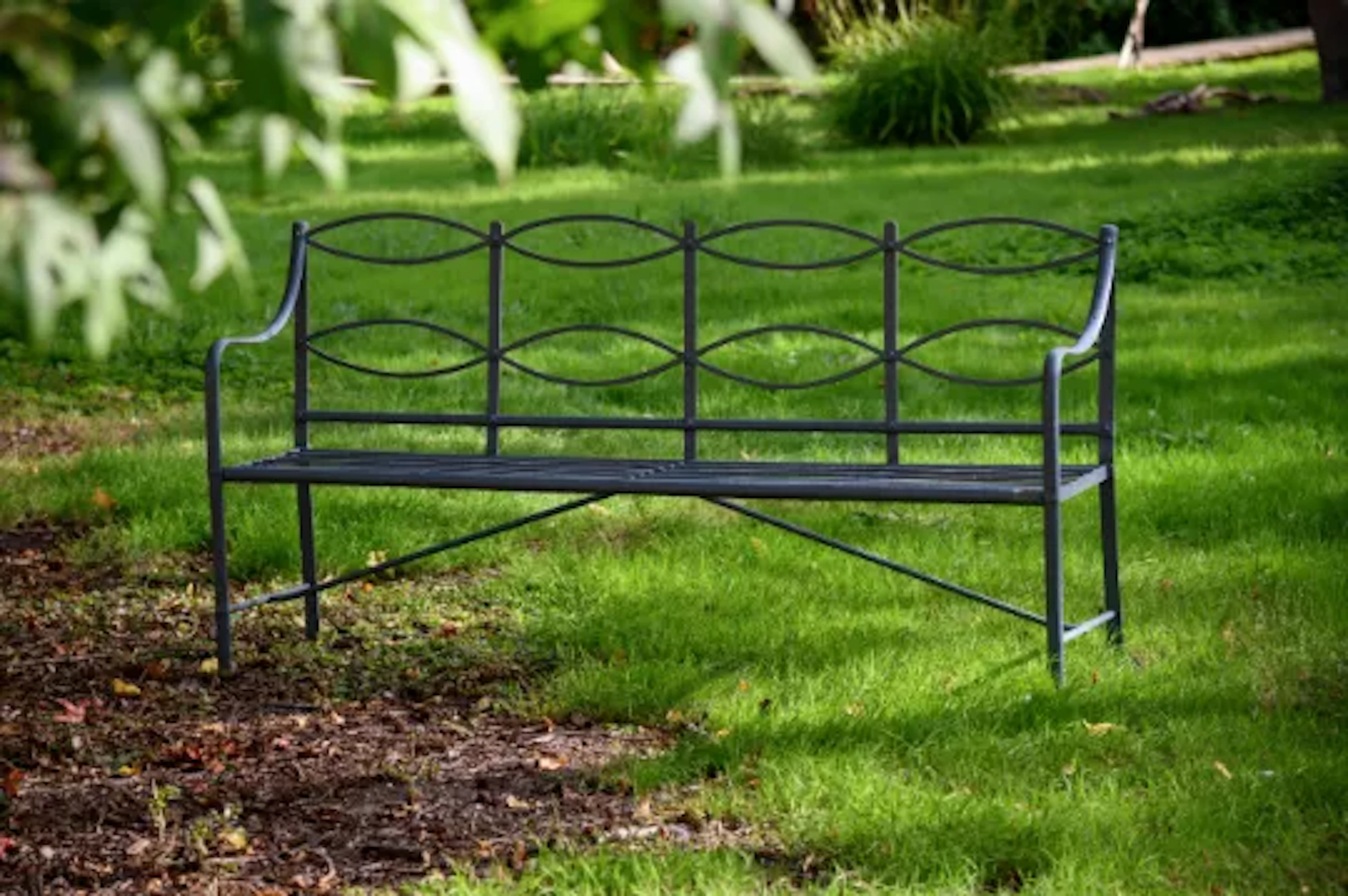 A REGENCY GREY PAINTED STRAPWORK IRON GARDEN BENCH, CIRCA 1820