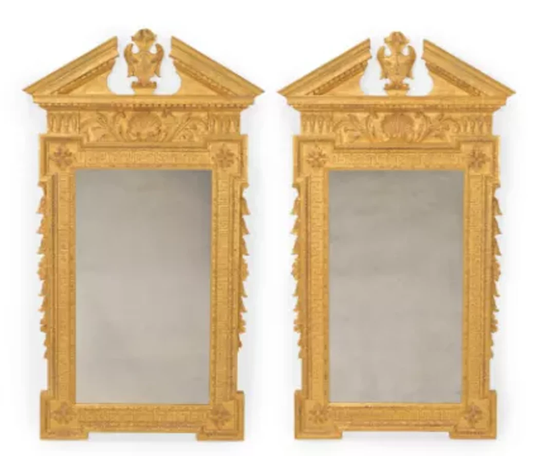 A PAIR OF CARVED GILTWOOD MIRRORS, IN GEORGE II STYLE, IN THE MANNER