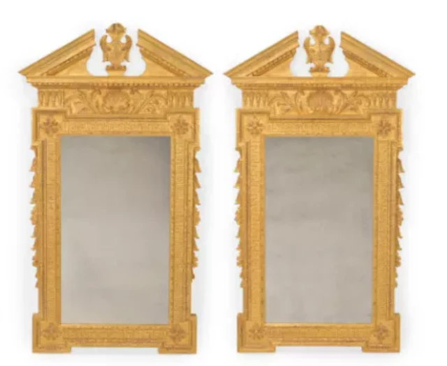 A PAIR OF CARVED GILTWOOD MIRRORS, IN GEORGE II STYLE, IN THE MANNER