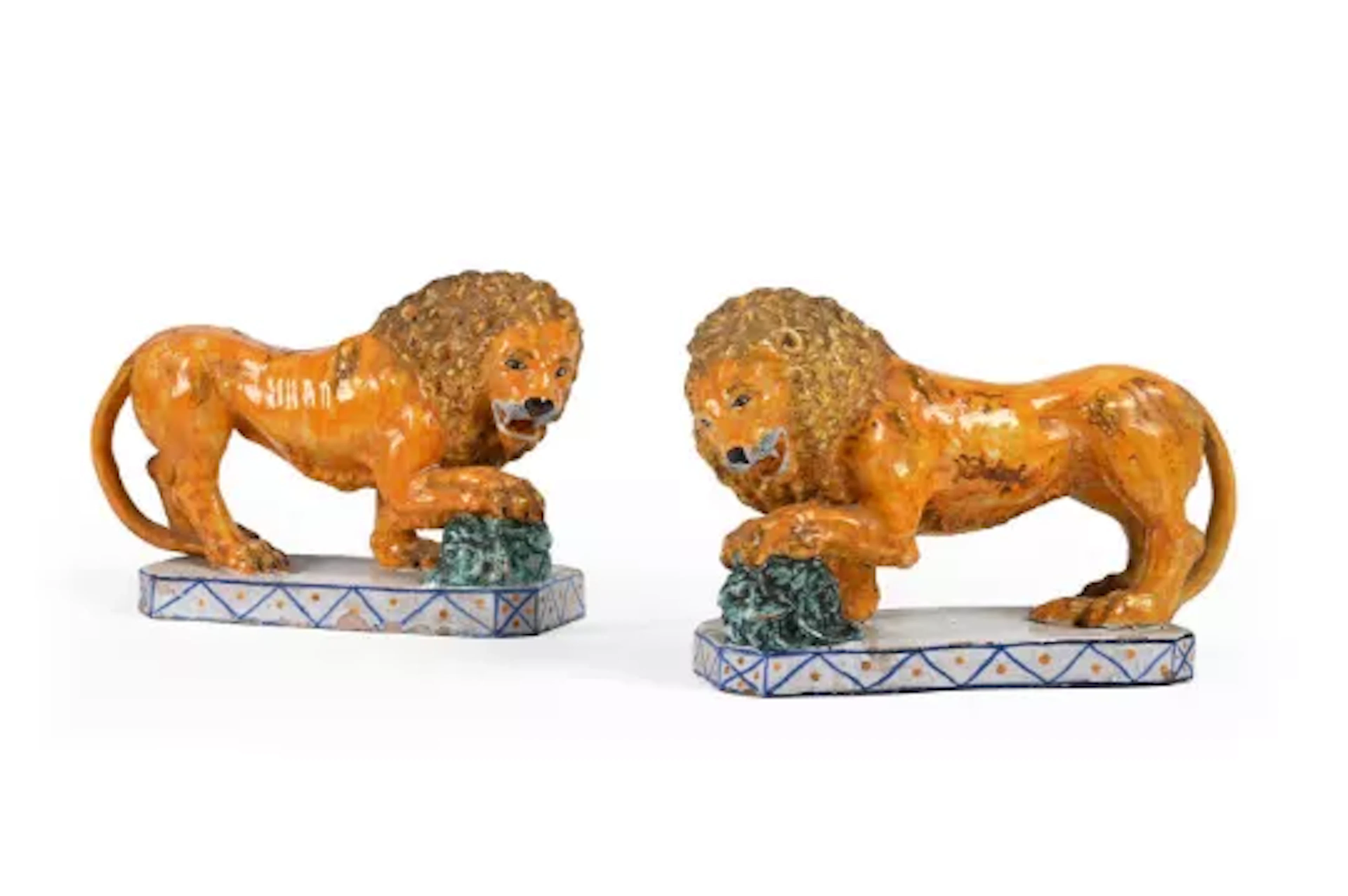 A PAIR OF SICILIAN MAIOLICA POTTERY FIGURES OF MEDICI LIONS, MODERN