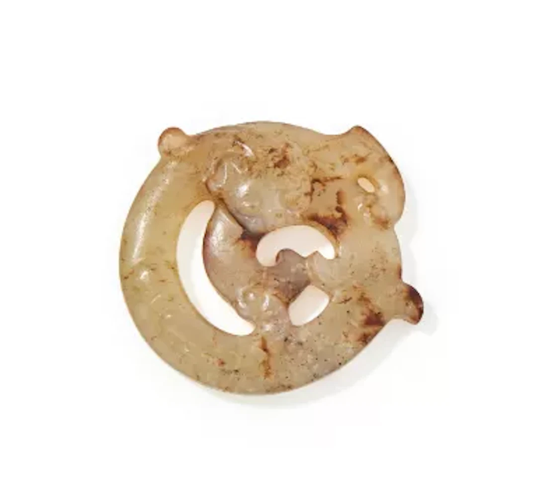 A Chinese jade carved openwork ‘Dragon’ pendant, Qing Dynasty