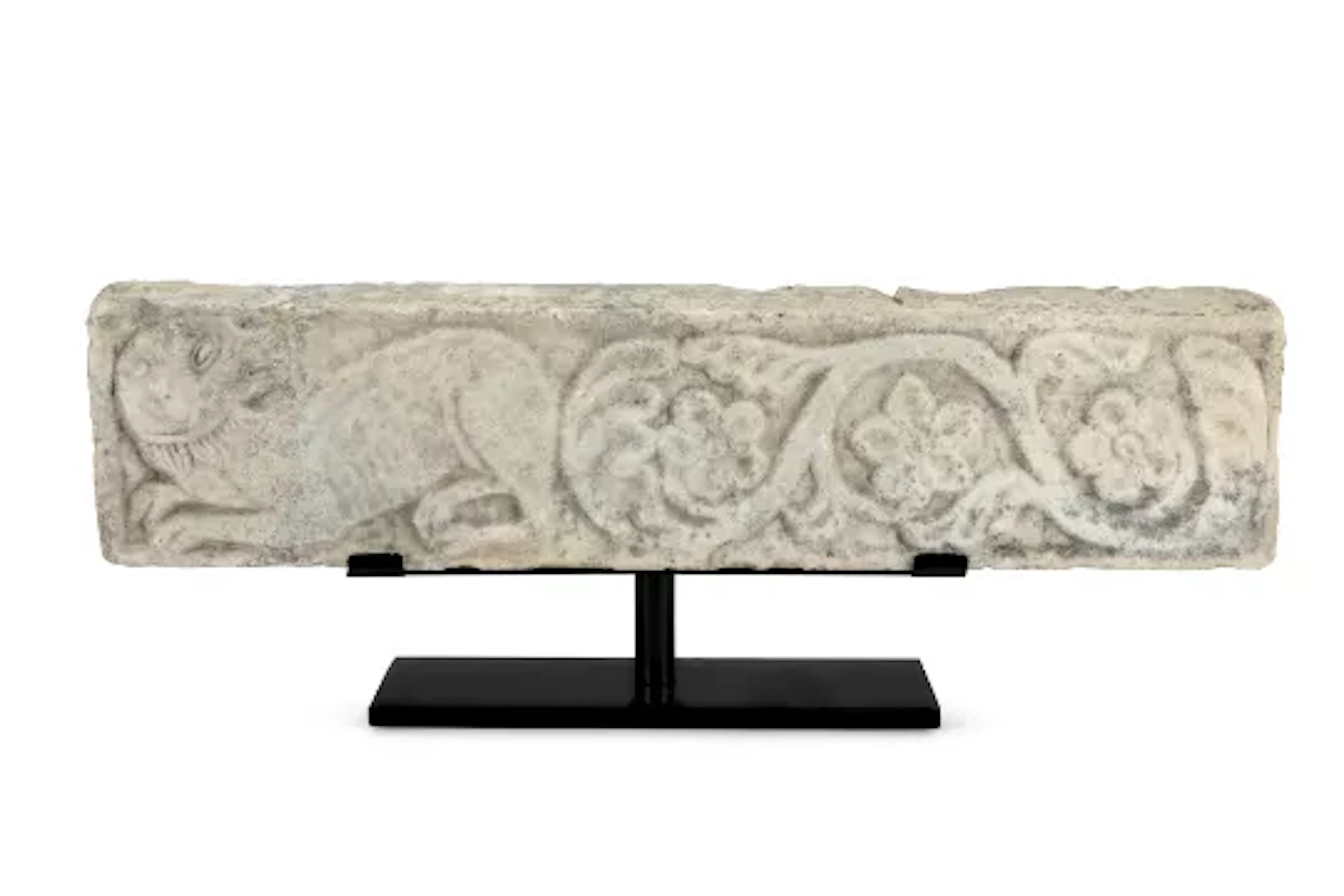 A MARBLE RELIEF DEPICTING A LION AND A TRELLIS OF FLOWERS, ITALIAN