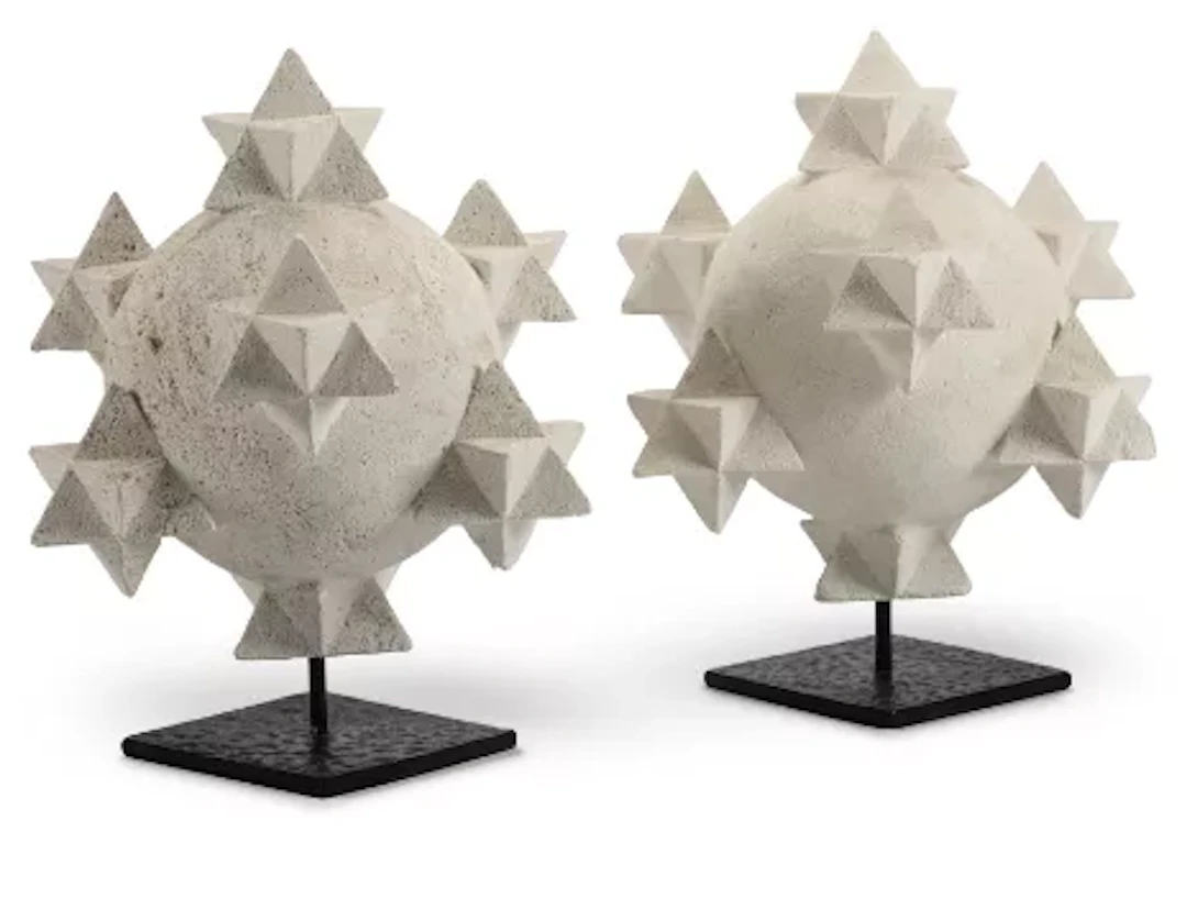 A PAIR OF BURGUNDY LIMESTONE SORCERER'S STONES 'PIERRES DE SORCIÈRE'