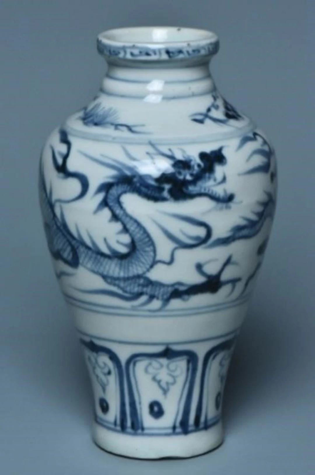 A YUAN DYNASTY BLUE AND WHITE DRAGON VASE
